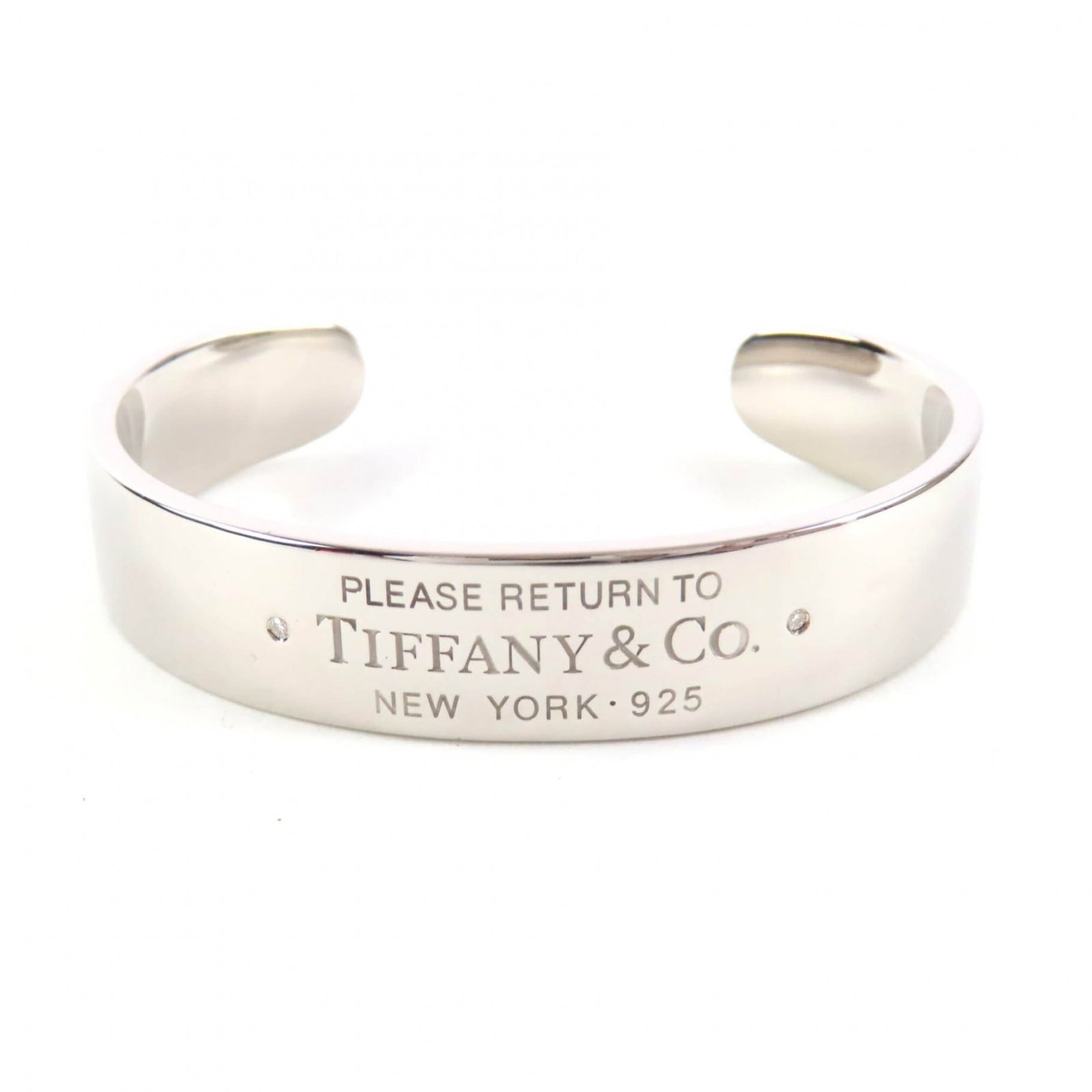 Tiffany silver bangle: Tiffany silver bangle A sleek and sophisticated Tiffany silver bangle, crafted from 925 sterling silver, adds a touch of elegance to any outfit with its understated yet refined design. Measuring 14cm