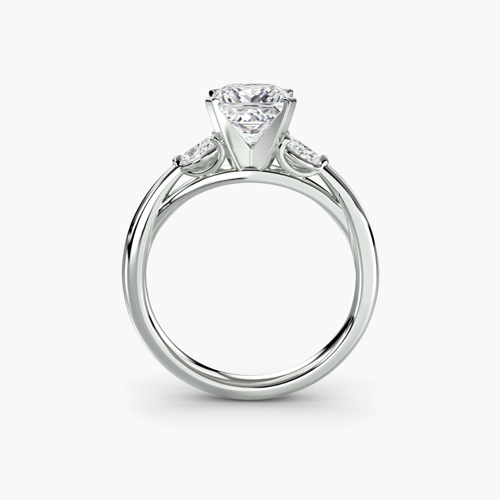 Side Stone Princess 14Kt White Gold Ring Setting: Side Stone Princess 14Kt White Gold Ring Setting Elegant and understated, this 14Kt white gold princess ring setting is designed to showcase four lab-grown side stones, totaling 0.43 carats of EF/VS