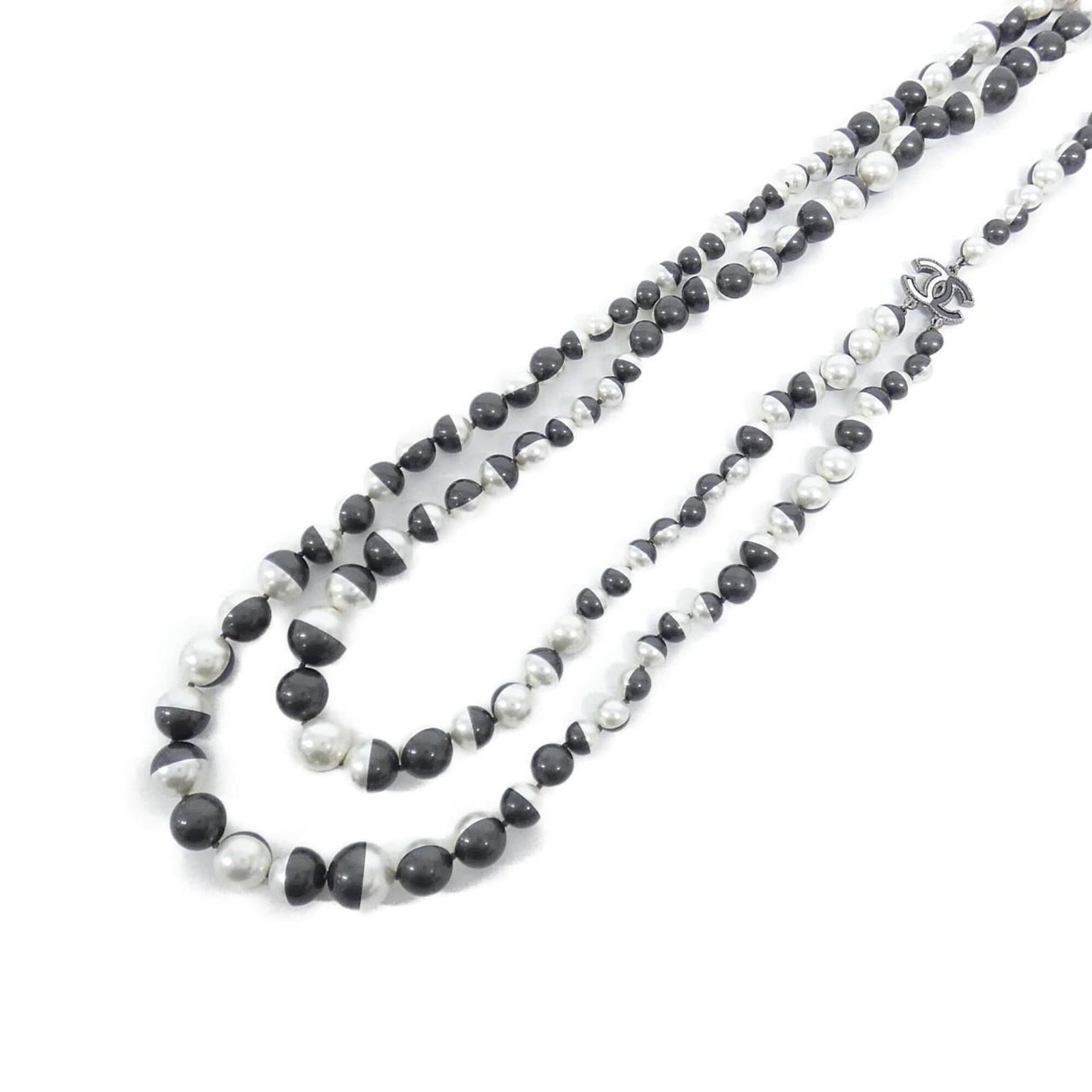 Chanel is a necklace: Chanel is a necklace A stylish Chanel necklace with a gray and white pendant, available in sizes 97-100cm to fit most neck circumferences. The necklace boasts a 15mm x 20mm pendant and is made from