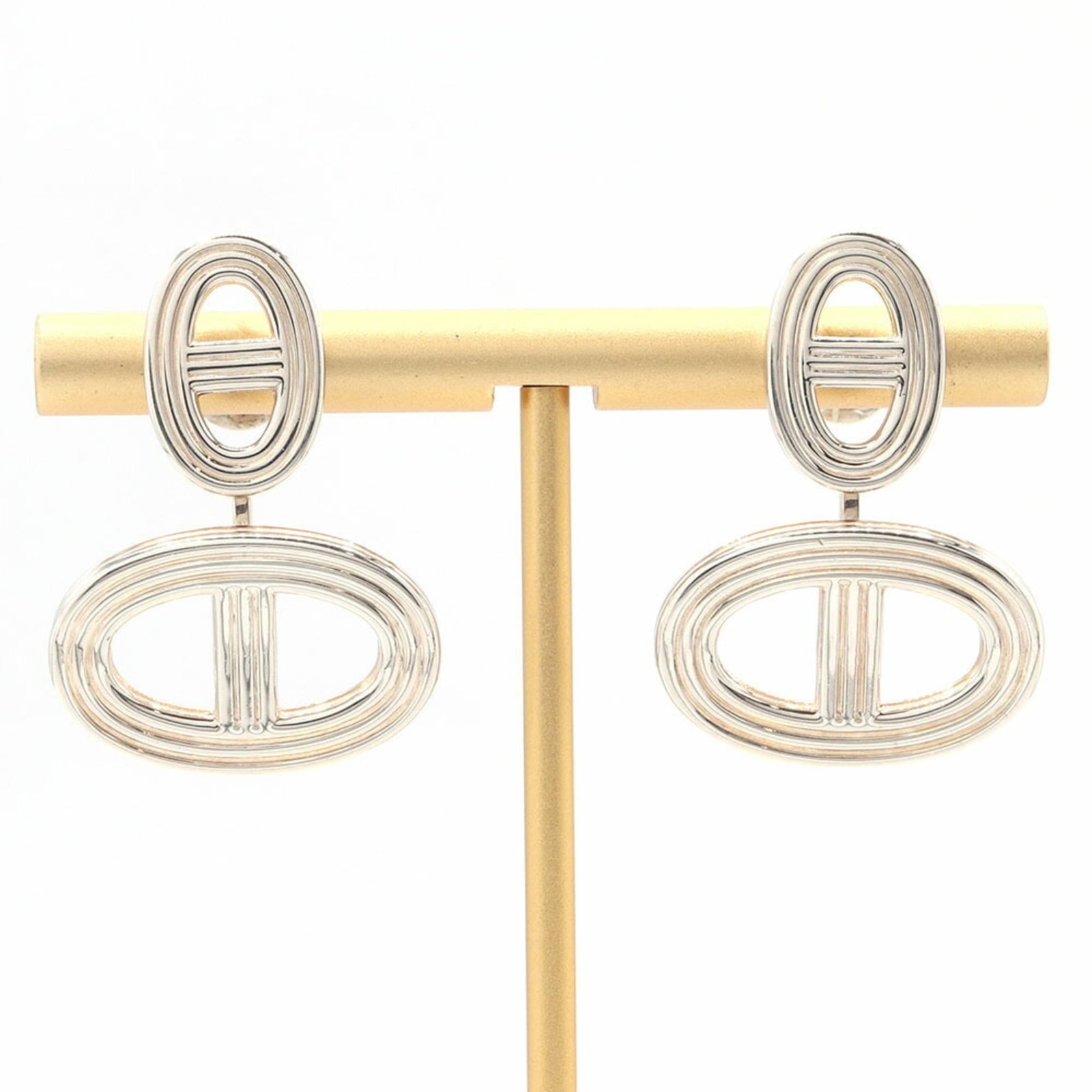 Sterling silver earrings by Hermes drop.: Sterling silver earrings by Hermes drop. Unique sterling silver drop earrings by Hermes, featuring a subtle touch of luxury with their sleek design and high-quality craftsmanship. With a few signs of