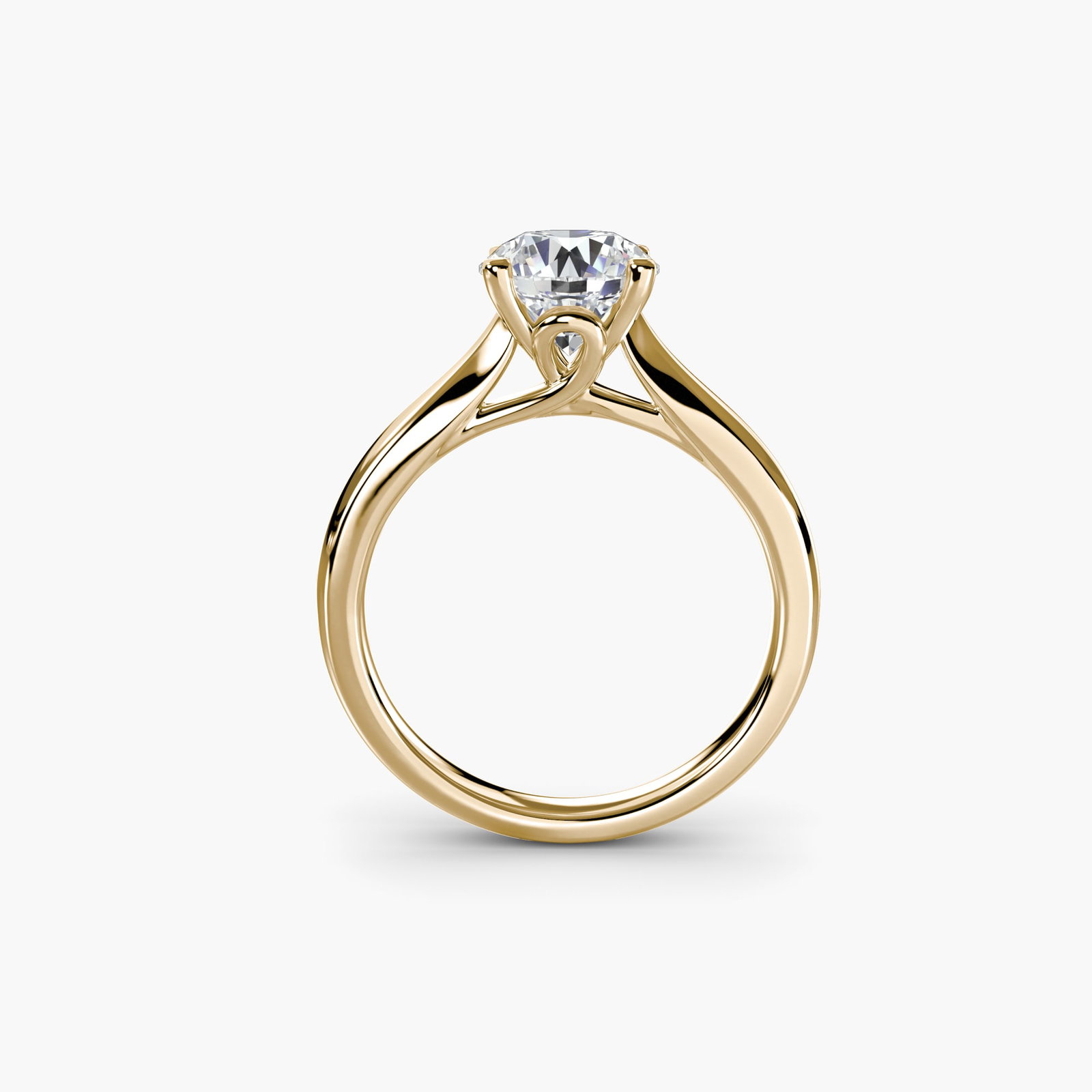 Solitaire Round 14Kt Yellow Gold Ring Setting: Solitaire Round 14Kt Yellow Gold Ring Setting Elegant simplicity is at the heart of this 14Kt yellow gold solitaire round ring setting, showcasing a clean and timeless design that lets the beauty of