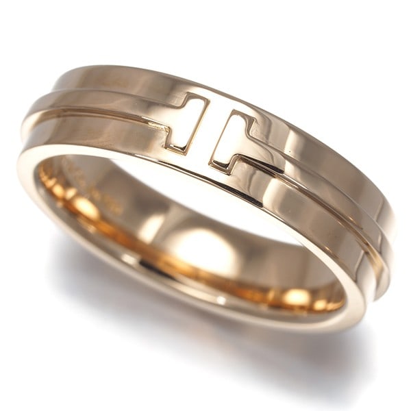 Tiffany & Co Tiffany T 18K wide rose gold ring: Tiffany & Co Tiffany T 18K wide rose gold ring A stunning 18k wide rose gold Tiffany & Co. ring from the iconic Tiffany T collection, showcasing the brand's signature style and craftsmanship. With its
