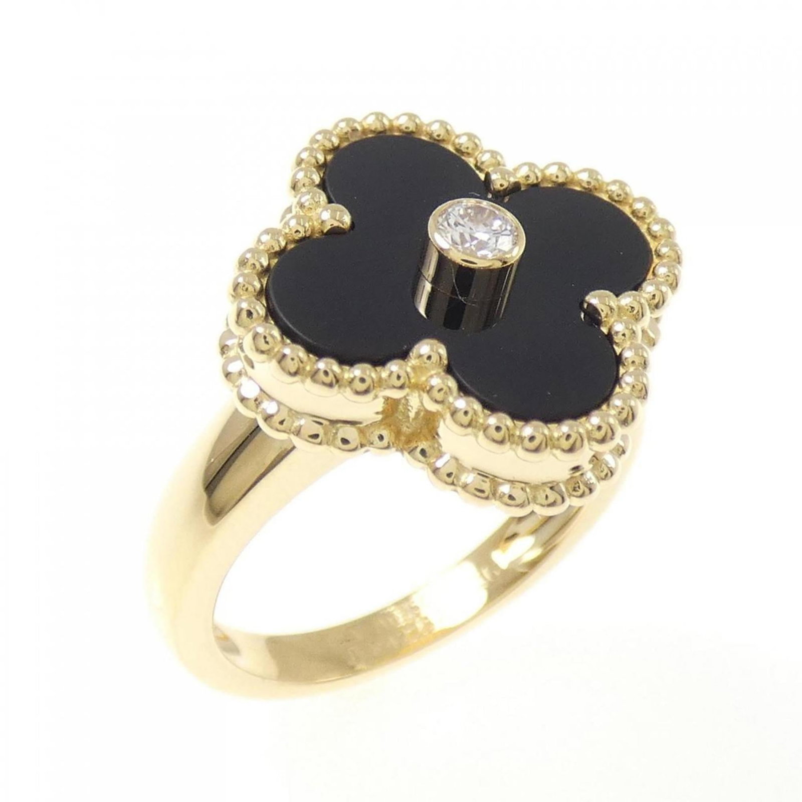 Van Cleef Arpels is a yellow gold band ring: Van Cleef Arpels is a yellow gold band ring A delicate 18K yellow gold band ring from Van Cleef & Arpels, adorned with a diamond and onyx stone, adds a touch of elegance to any outfit. With its classi