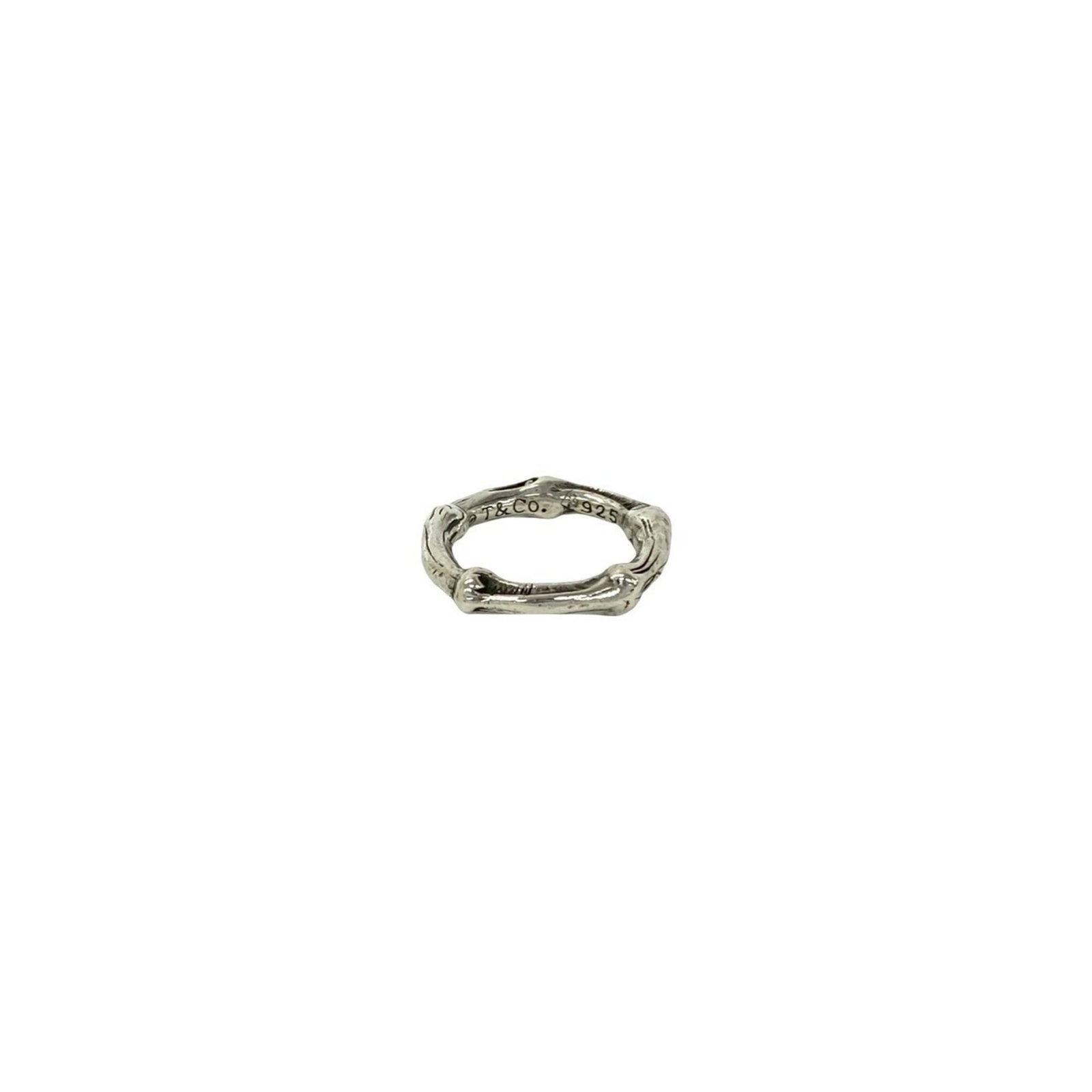 Tiffany silver ring band.: Tiffany silver ring band. A 925 sterling silver Tiffany ring band with a classic design, this used piece features a subtle shine and a touch of everyday wear. With some minor scratches and signs of