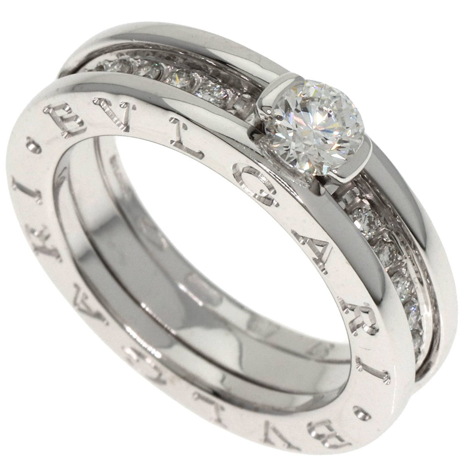 Bvlgari Band Ring White Gold (18K): Bvlgari Band Ring White Gold (18K) A sleek Bvlgari band ring in 18K white gold, adorned with a diamond stone, adds a touch of luxury to any outfit. This pre-owned piece boasts a classic design and pre
