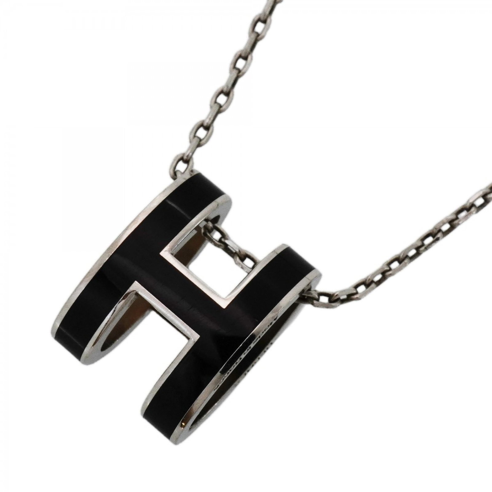 Hermes pop metal necklace silver and black for women: Hermes pop metal necklace silver and black for women A sleek and sophisticated silver and black metal necklace from the iconic French fashion house Hermes. This pop metal design showcases a striking