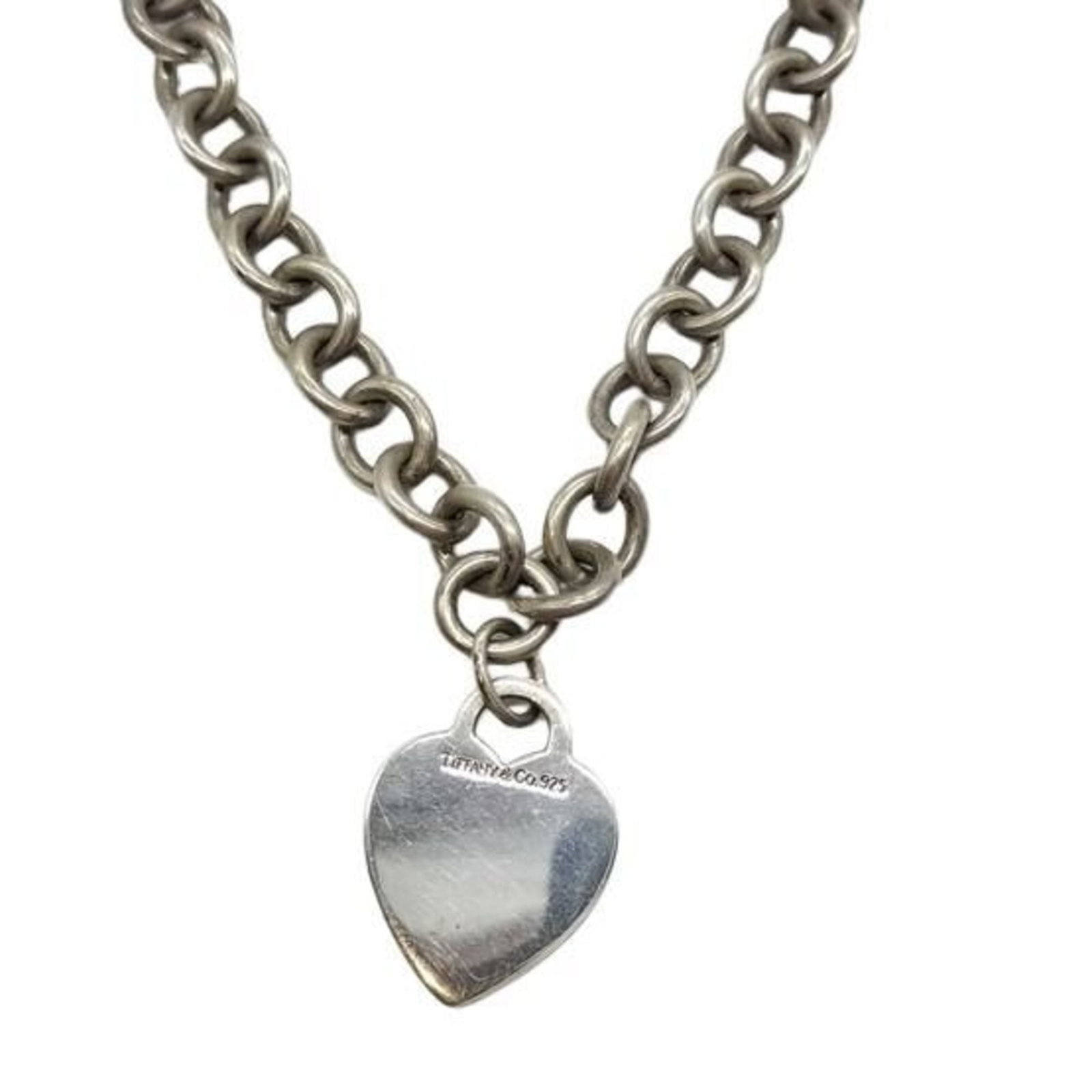 Tiffany & Co sterling silver women's heart necklace: Tiffany & Co sterling silver women's heart necklace A beautiful sterling silver heart pendant from Tiffany & Co., featuring a classic design that exudes elegance and sophistication. The necklace