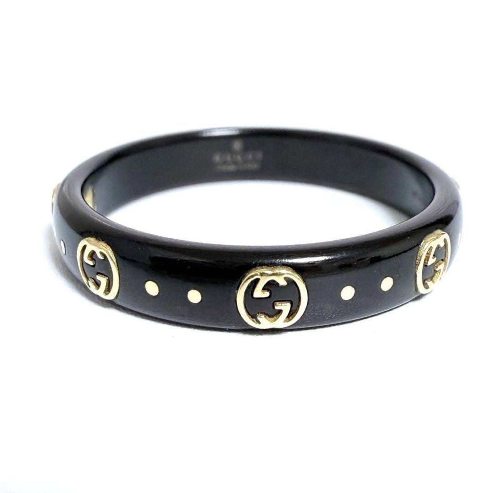 Gucci is a yellow gold band ring.: Gucci is a yellow gold band ring. A 18K yellow gold band ring from Gucci, available in size 10, offers a touch of luxury to any outfit with its understated elegance. With some minor signs of wear,