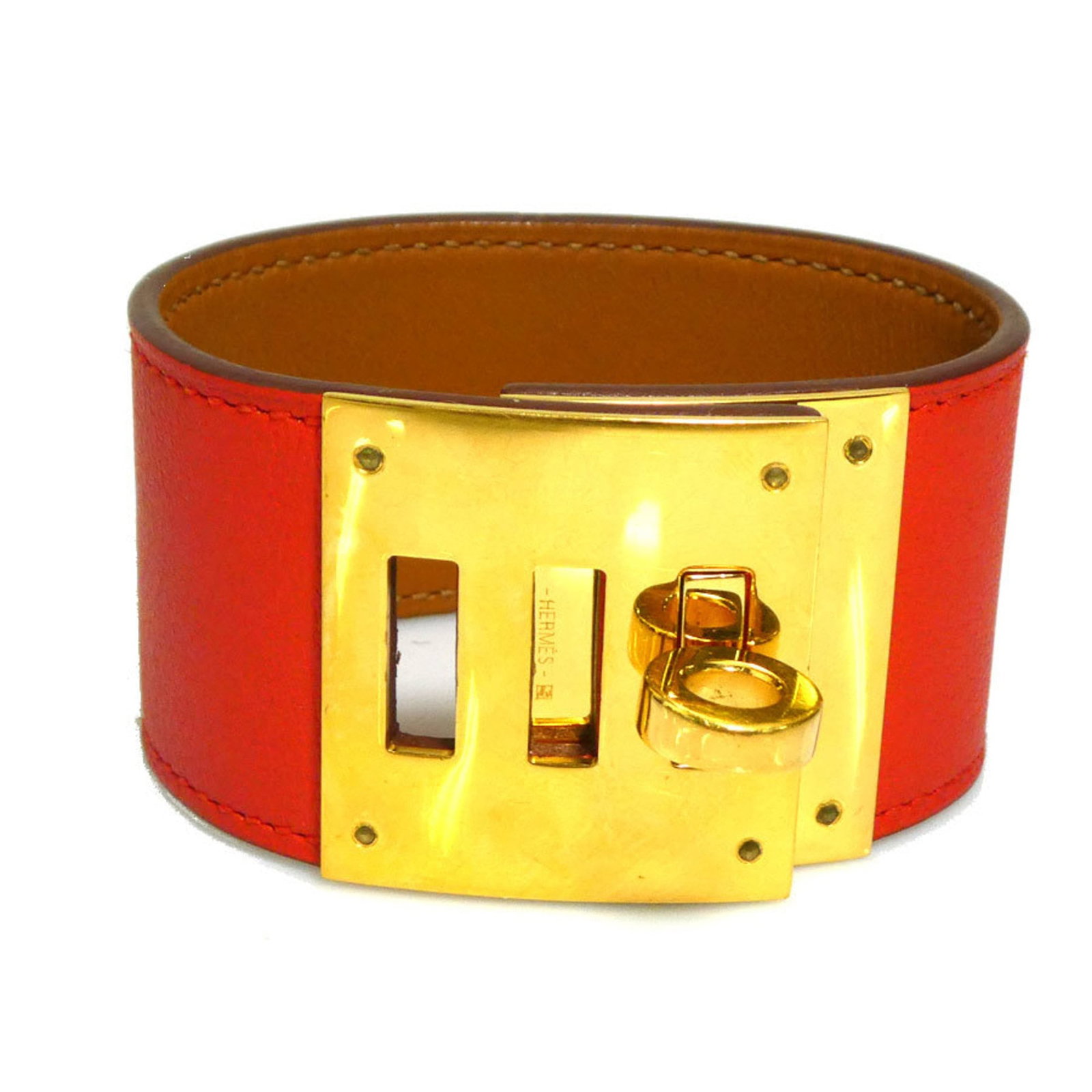 Hermes Charm Leather Bracelet: Hermes Charm Leather Bracelet A vibrant orange-red leather charm bracelet from iconic French fashion house Hermes, featuring a classic design with subtle signs of wear. With its 3.3cm wide band and
