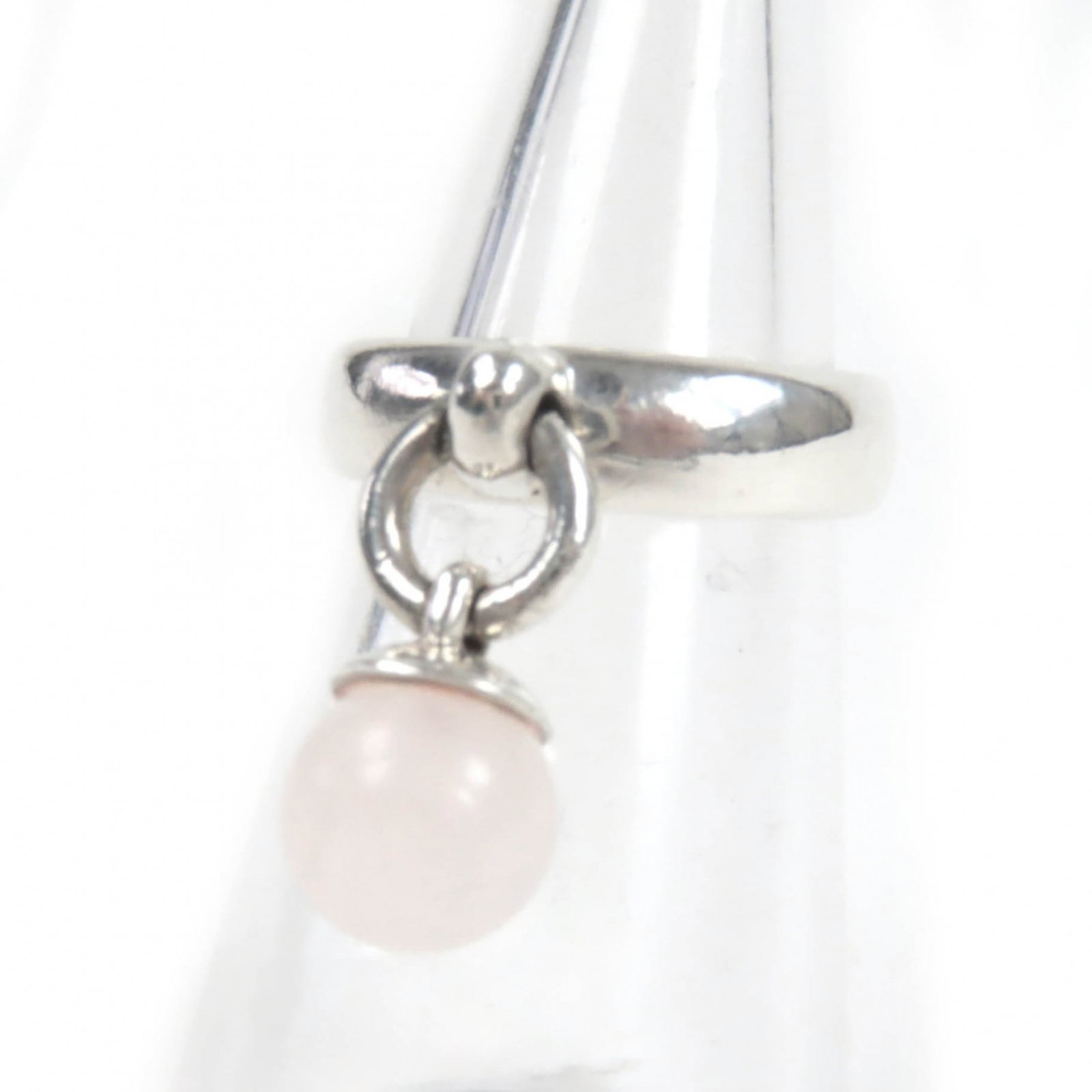 Tiffany band ring: Tiffany band ring A sleek and understated silver band ring from Tiffany, featuring a subtle quartz stone. With its classic design and everyday wearability, this ring is perfect for adding a touch of