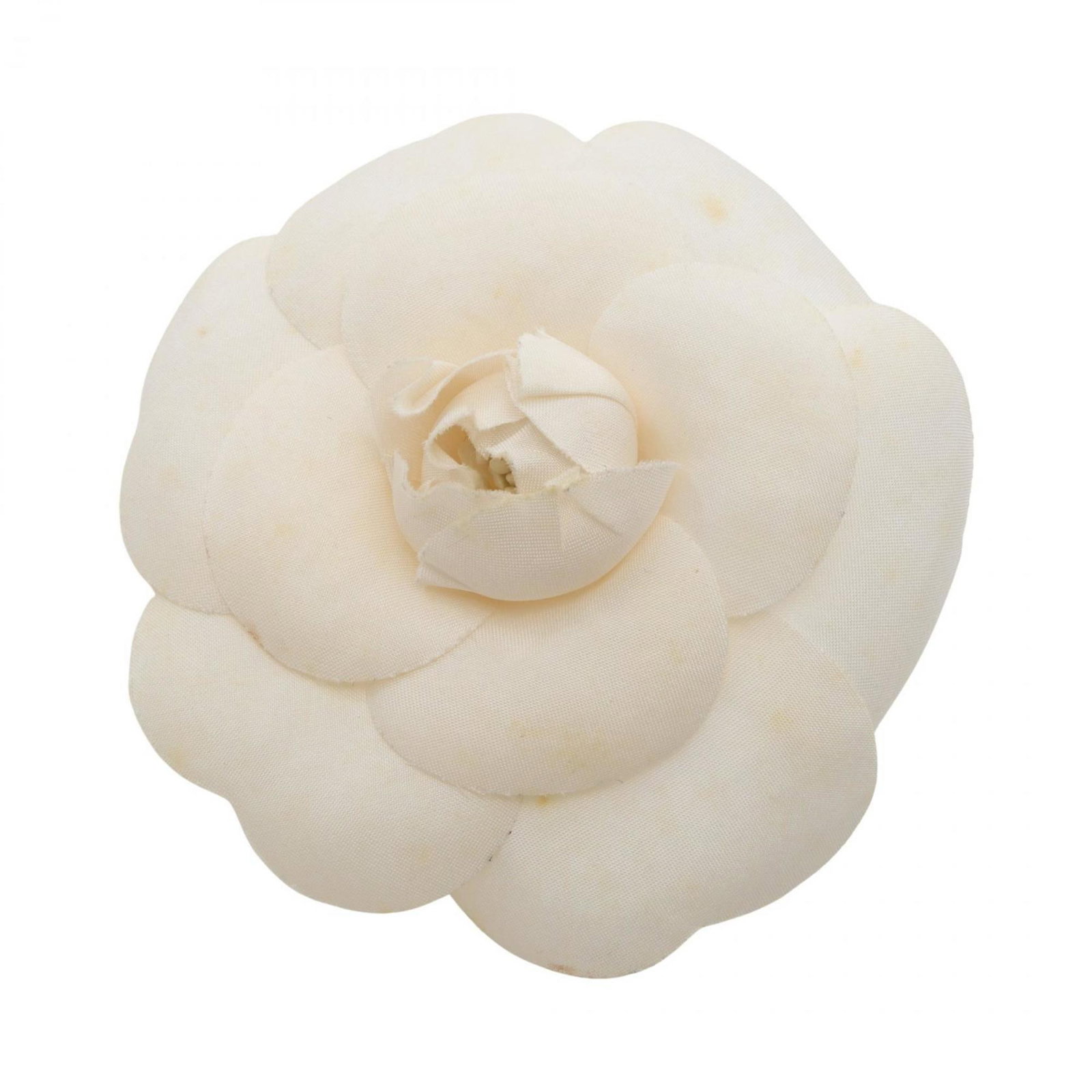 Chanel is a brooch: Chanel is a brooch A crisp white Chanel brooch with subtle signs of wear, offering a touch of timeless elegance to any outfit. This used piece boasts its original design and style, despite minor