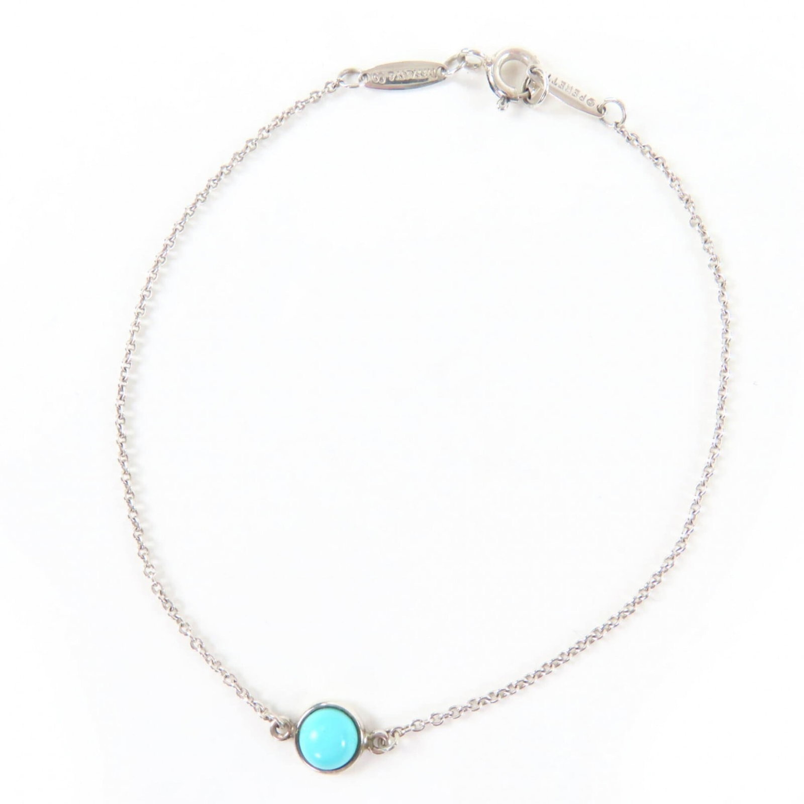 Tiffany Charm Bracelet Silver 925: Tiffany Charm Bracelet Silver 925 A beautiful Tiffany charm bracelet made from sterling silver 925, this elegant piece boasts a stunning blue hue and intricate details. With its classic design and