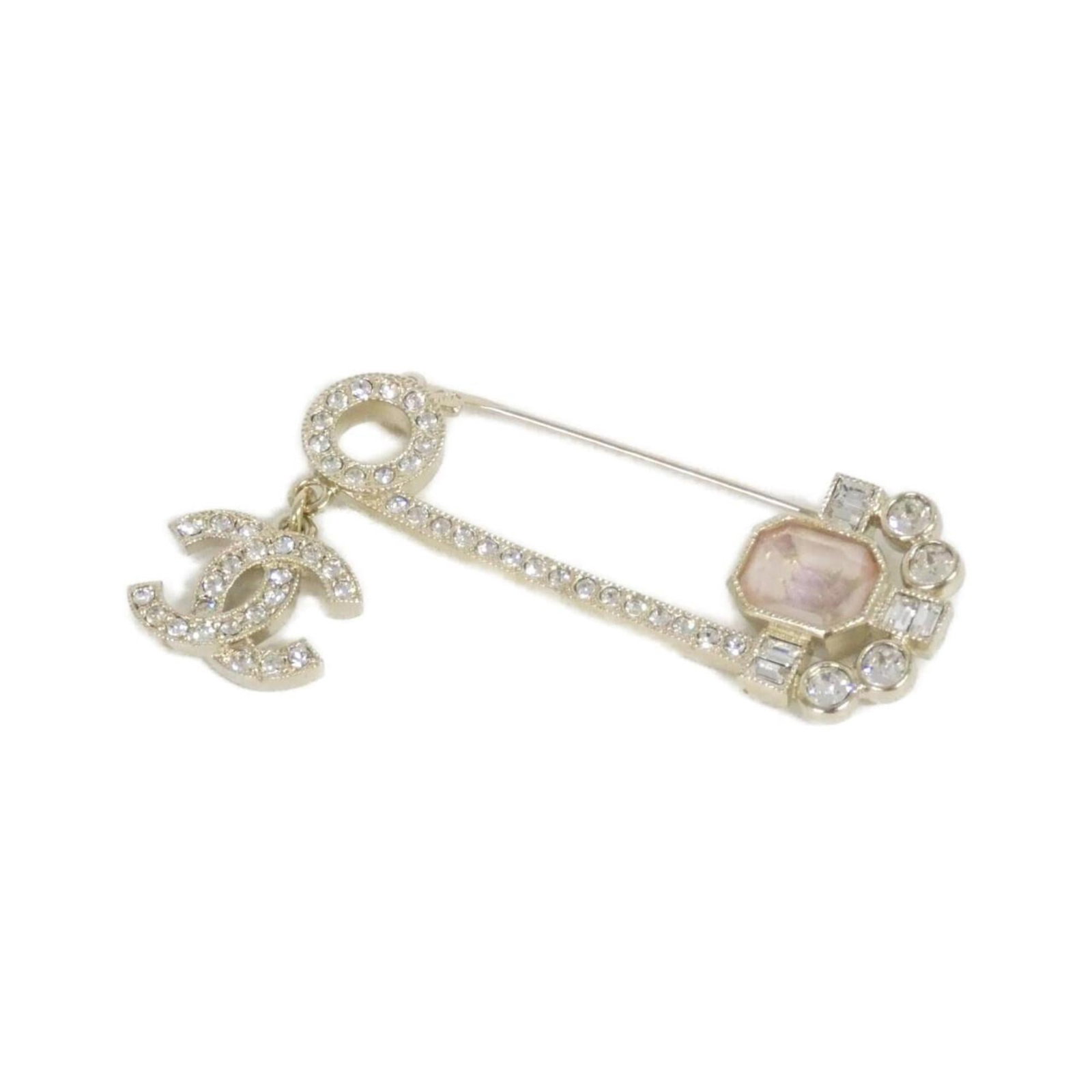 Chanel is a brooch: Chanel is a brooch A delicate pink Chanel brooch with subtle signs of wear, adding a touch of vintage charm to any outfit. Measuring 3.5cm x 5.5cm, this elegant piece is in very good condition