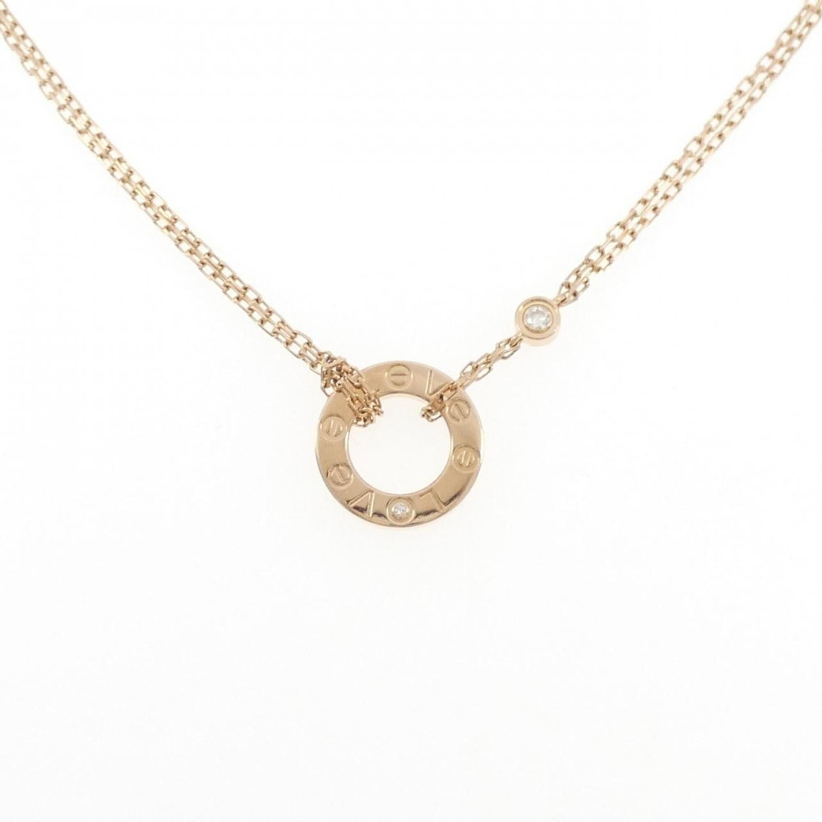 Cartier a necklace.: Cartier a necklace. A stunning Cartier necklace featuring a 13mm x 13mm diamond pendant set in pink gold (18K), this elegant piece is adorned with subtle signs of wear, reflecting its used condition. 