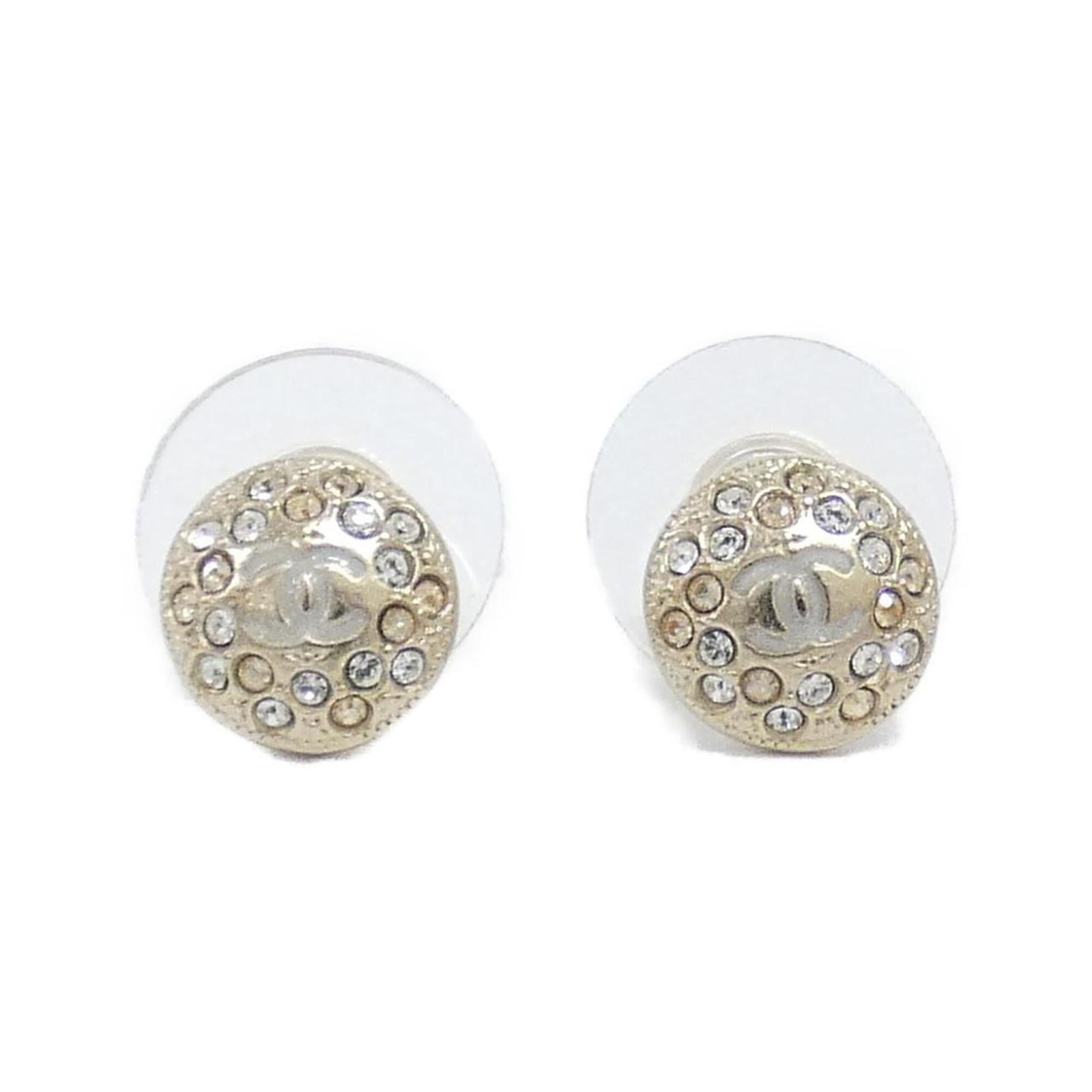 Chanel Stud Earrings: Chanel Stud Earrings Authentic Chanel stud earrings in gold and yellow, featuring a classic design with subtle details. With some minor signs of wear, these earrings still shine with their timeless el