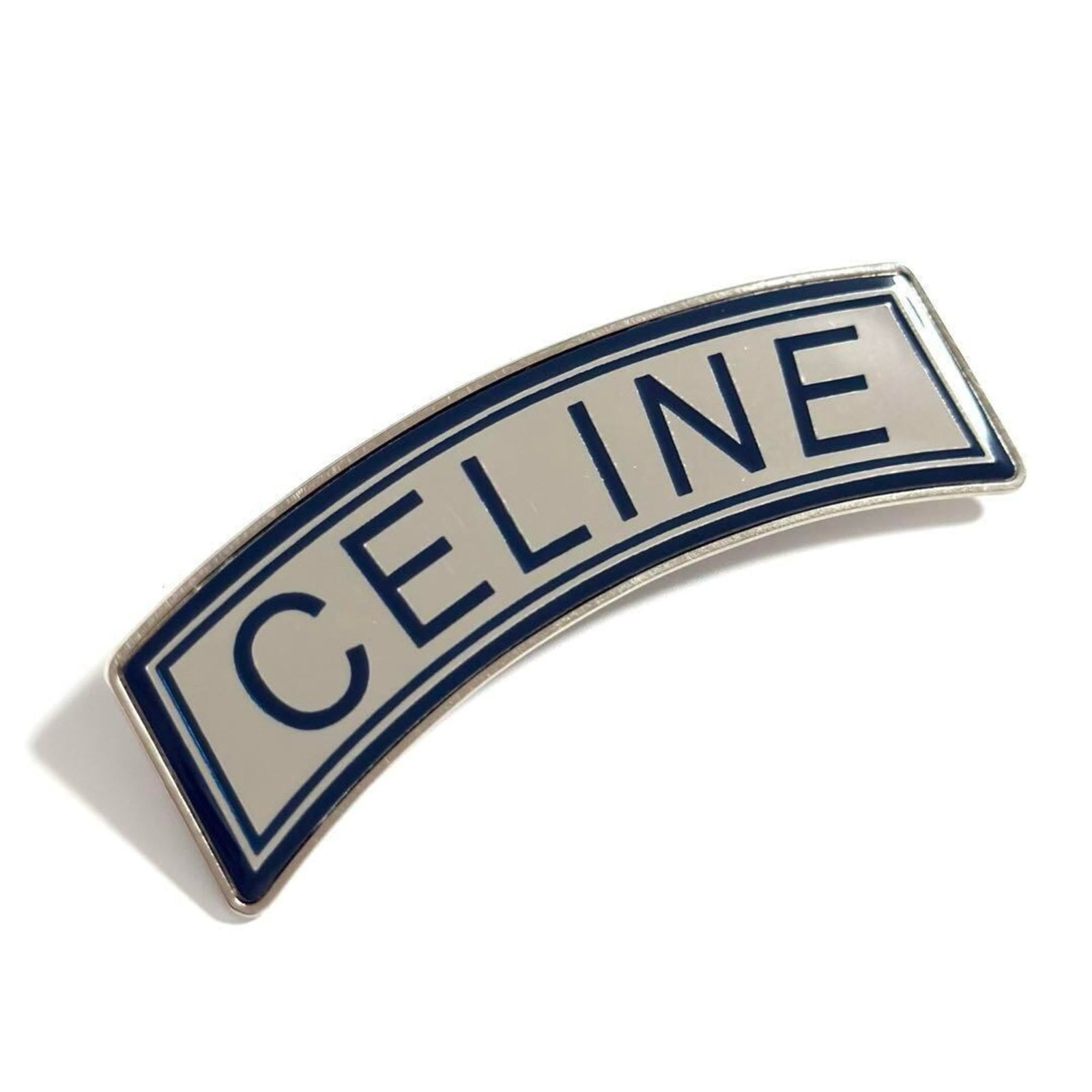 Celine is a metal brooch.: Celine is a metal brooch. A sleek and elegant metal brooch from Celine, available in blue and silver tones, measuring 2.5cm x 8cm. This brooch is presented in mint condition, with a like-new