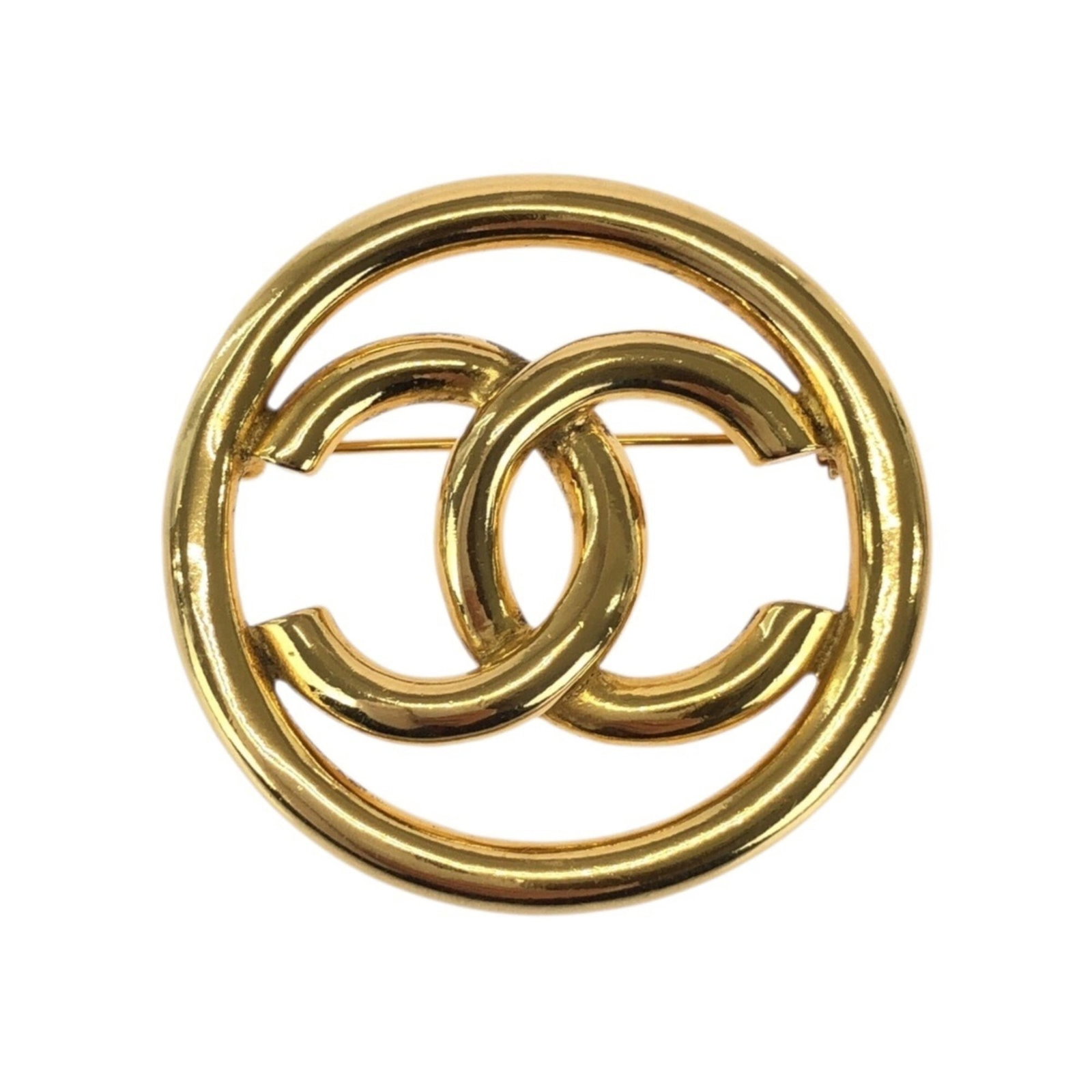 Chanel is a brooch: Chanel is a brooch A stunning gold brooch from the iconic Chanel brand, this vintage piece boasts a timeless design that exudes elegance and sophistication. Measuring 45cm x 45cm, its intricate