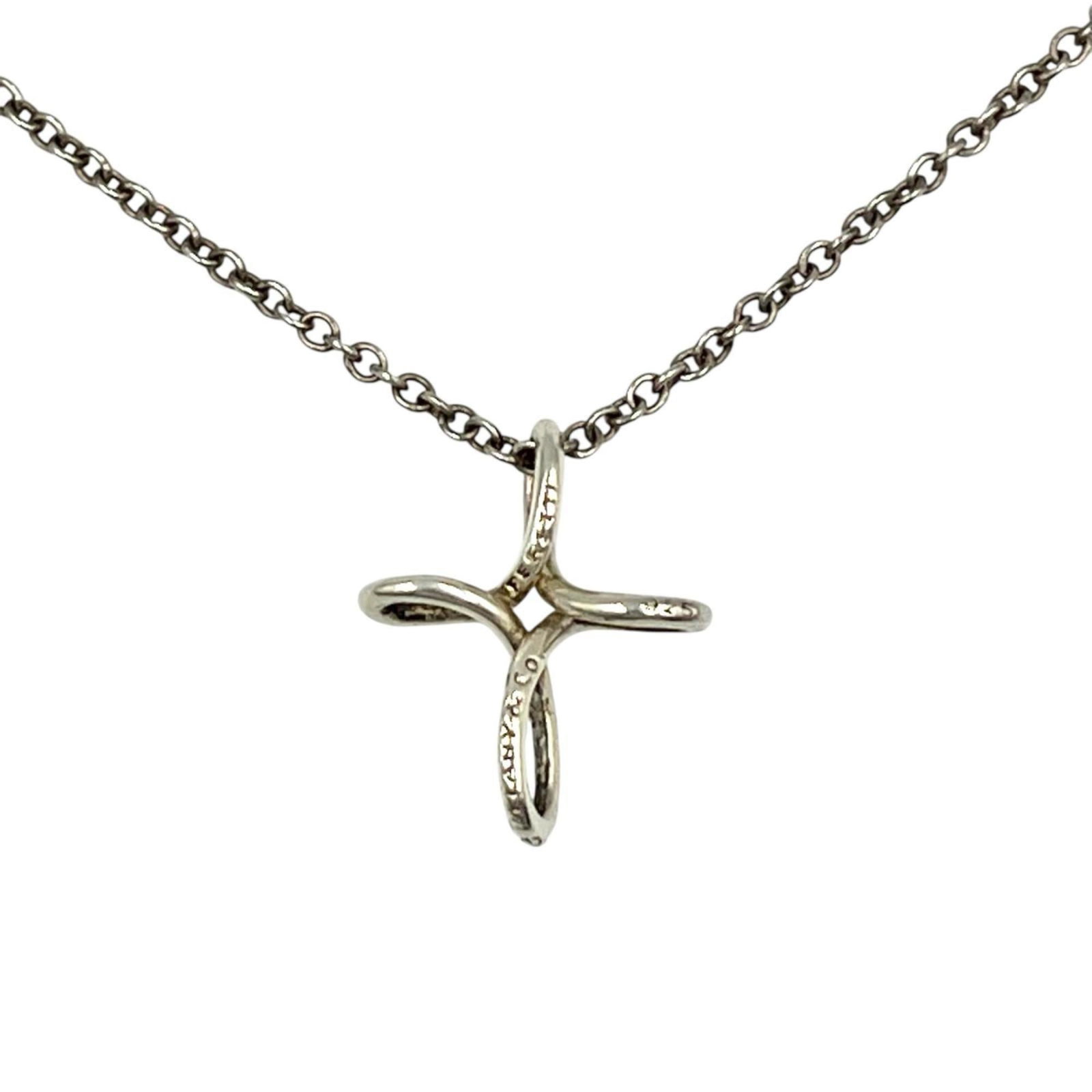 Tiffany & Co. Open Cross Necklace, Peretti, Sterling Silver 925, Women's: Tiffany & Co. Open Cross Necklace, Peretti, Sterling Silver 925, Women's Tiffany & Co.'s iconic Open Cross Necklace is a timeless piece of elegance, featuring a sterling silver 925 design with subtle