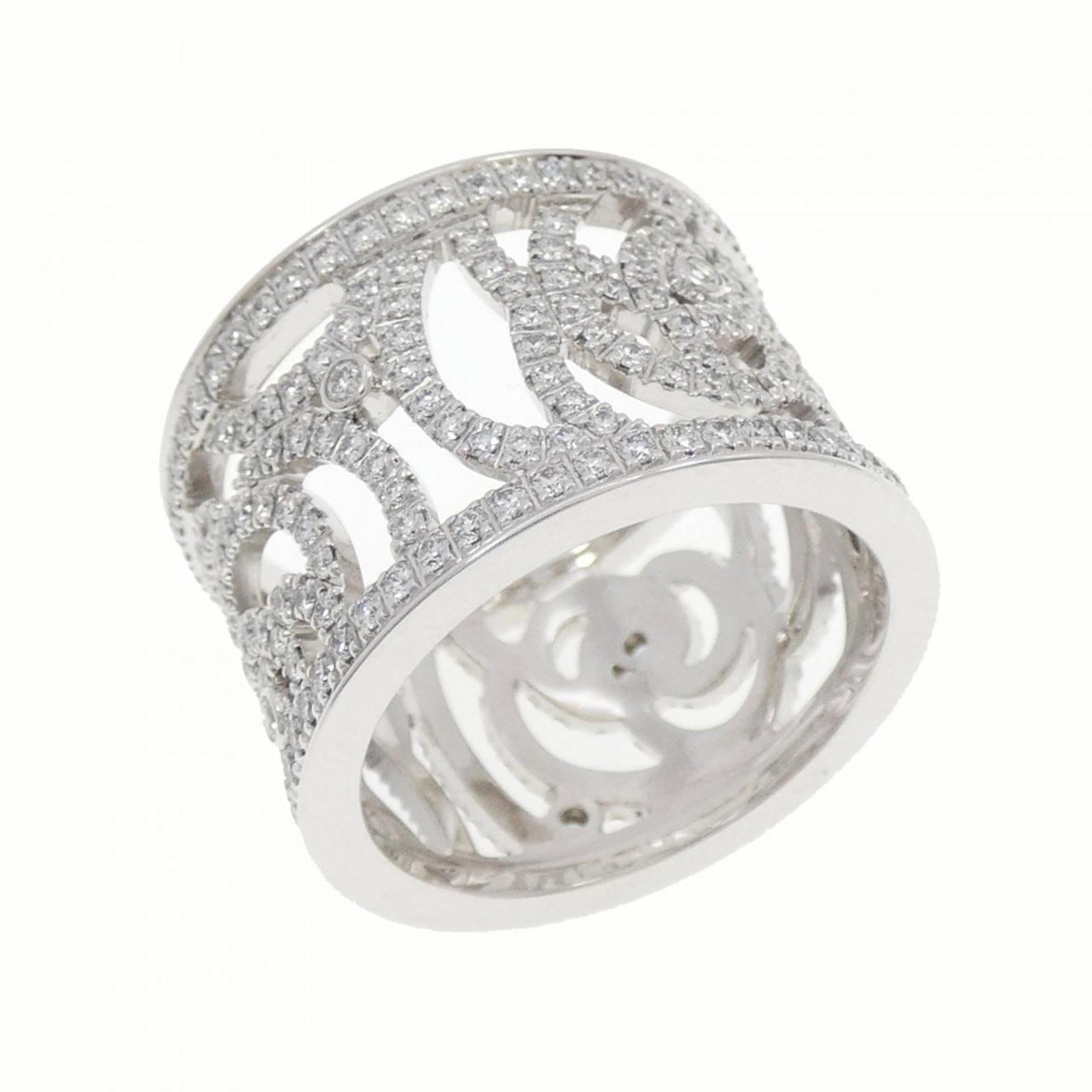 Chanel white gold band ring: Chanel white gold band ring A beautiful Chanel white gold band ring, featuring 18K white gold and a diamond stone, available in size 6.5. This elegant ring has a width of 14mm and weighs 10.2g, with