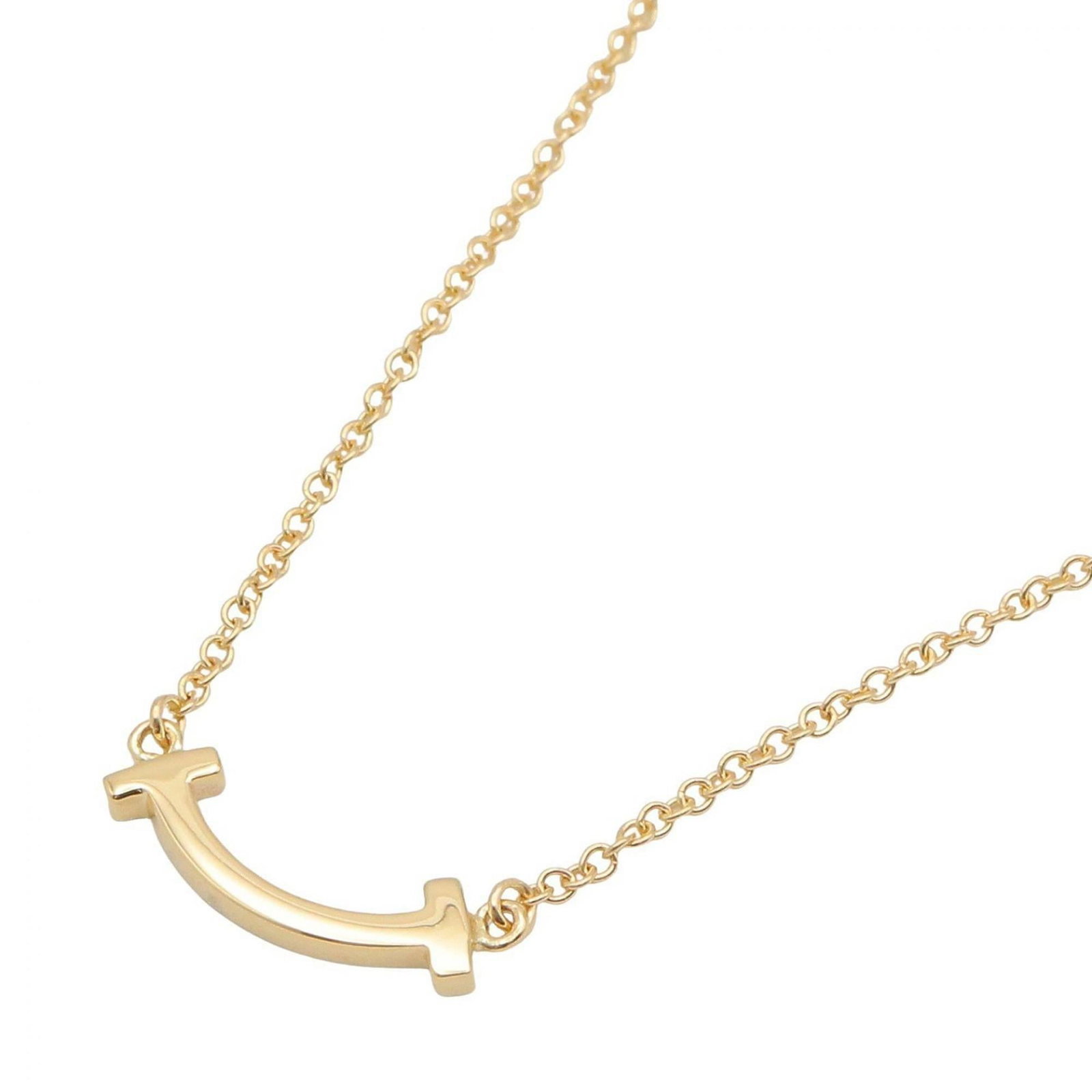 Tiffany & Co. T Smile Mini Necklace, 18K (Yellow Gold), Gold Tone, Men's Women's, Item Number: Tiffany & Co. T Smile Mini Necklace, 18K (Yellow Gold), Gold Tone, Men's Women's, Item Number A delicate 18K yellow gold Tiffany & Co. T Smile Mini Necklace is available for purchase. This elegant