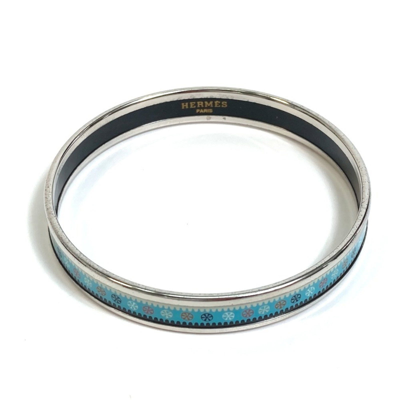 Hermes Bangle Cloisonn/ Enamel: Hermes Bangle Cloisonn/ Enamel A stunning Hermes bangle boasts a striking cloisonn? and enamel design in blue and light blue hues, adding a touch of elegance to any outfit. The 19.5cm length and 9mm