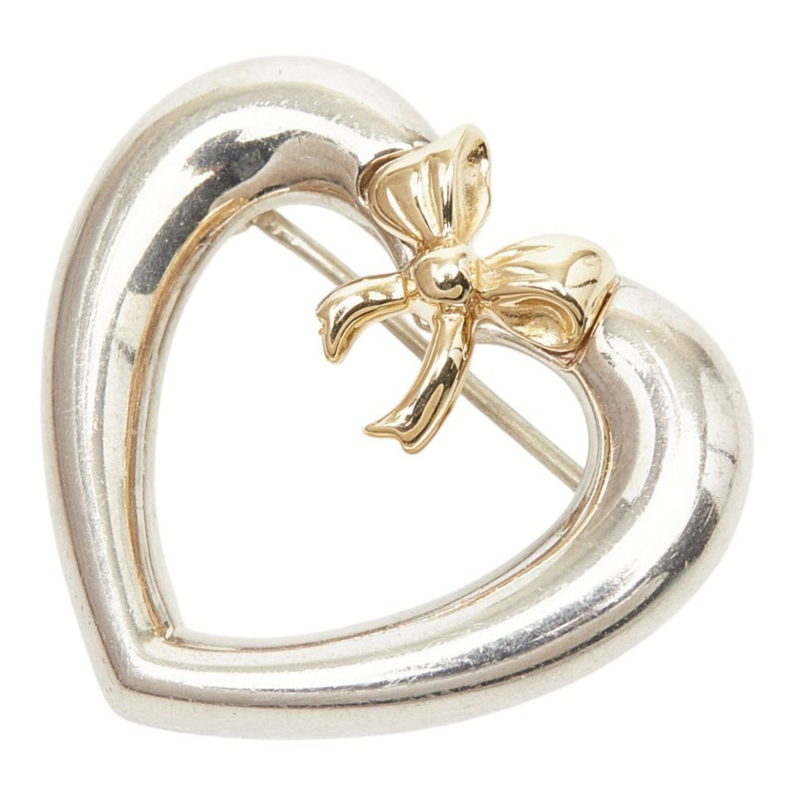 Tiffany gold brooch 18k silver: Tiffany gold brooch 18k silver A stunning 18k gold brooch with intricate design, crafted by Tiffany and set against a backdrop of 925 silver. The piece boasts a rich gold hue and measures