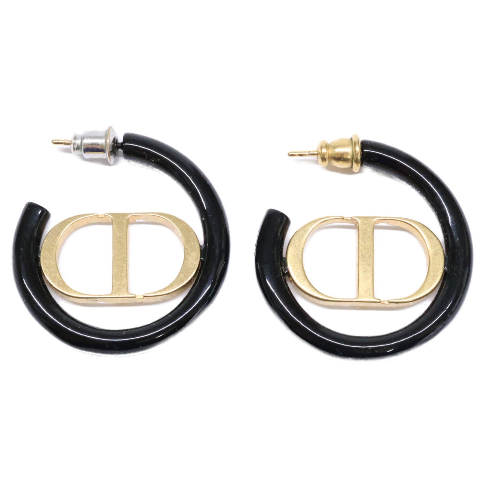 Christian Dior Stud Metal Earrings: Christian Dior Stud Metal Earrings Elevate your everyday look with these sleek Christian Dior stud metal earrings in black and gold. Featuring the iconic Dior design, these earrings showcase a subtle