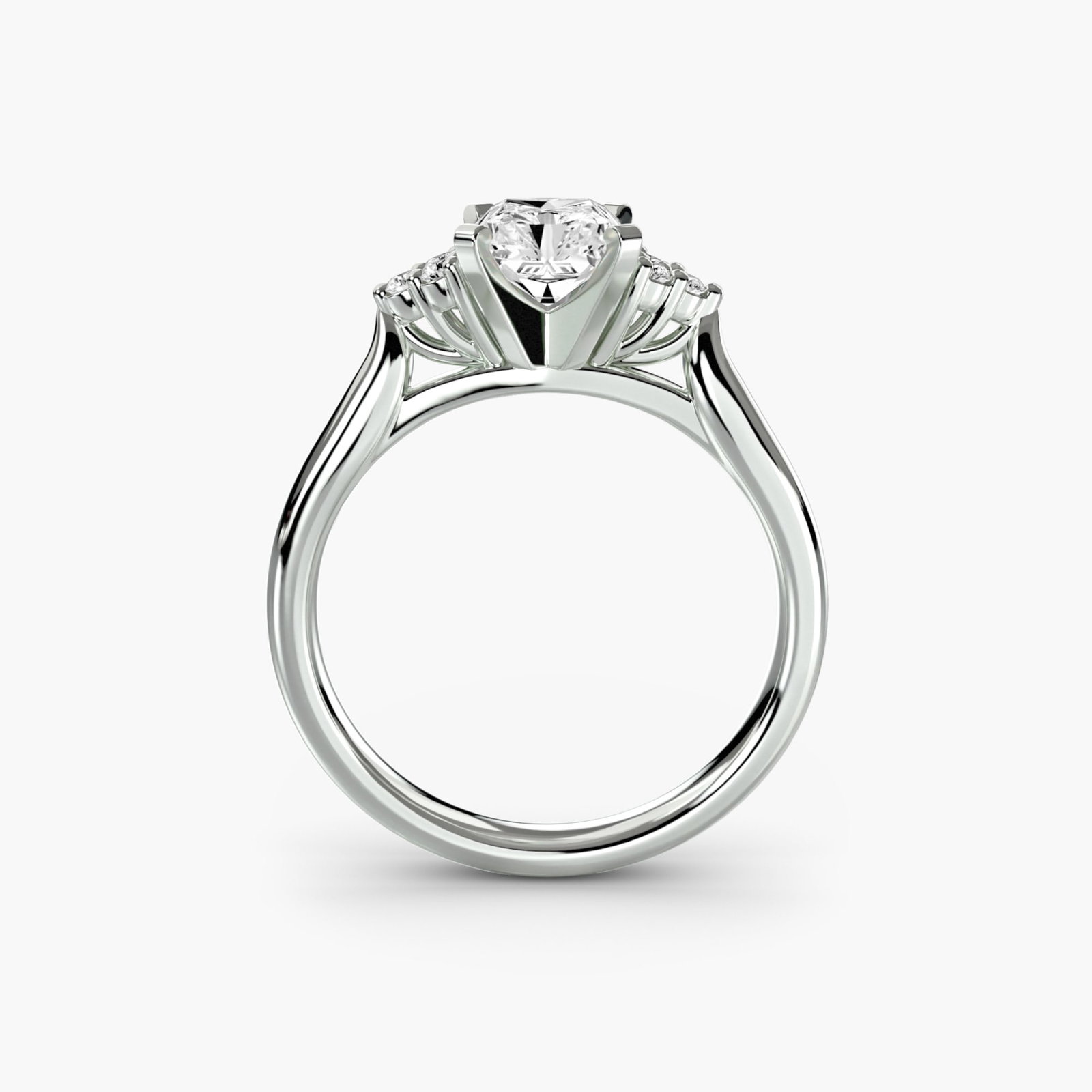 Solitaire Radiant 18Kt White Gold Ring Setting: Solitaire Radiant 18Kt White Gold Ring Setting Elegant and understated, this 18Kt White Gold Radiant Ring Setting is a versatile foundation for your favorite diamond. With its slender profile and six 