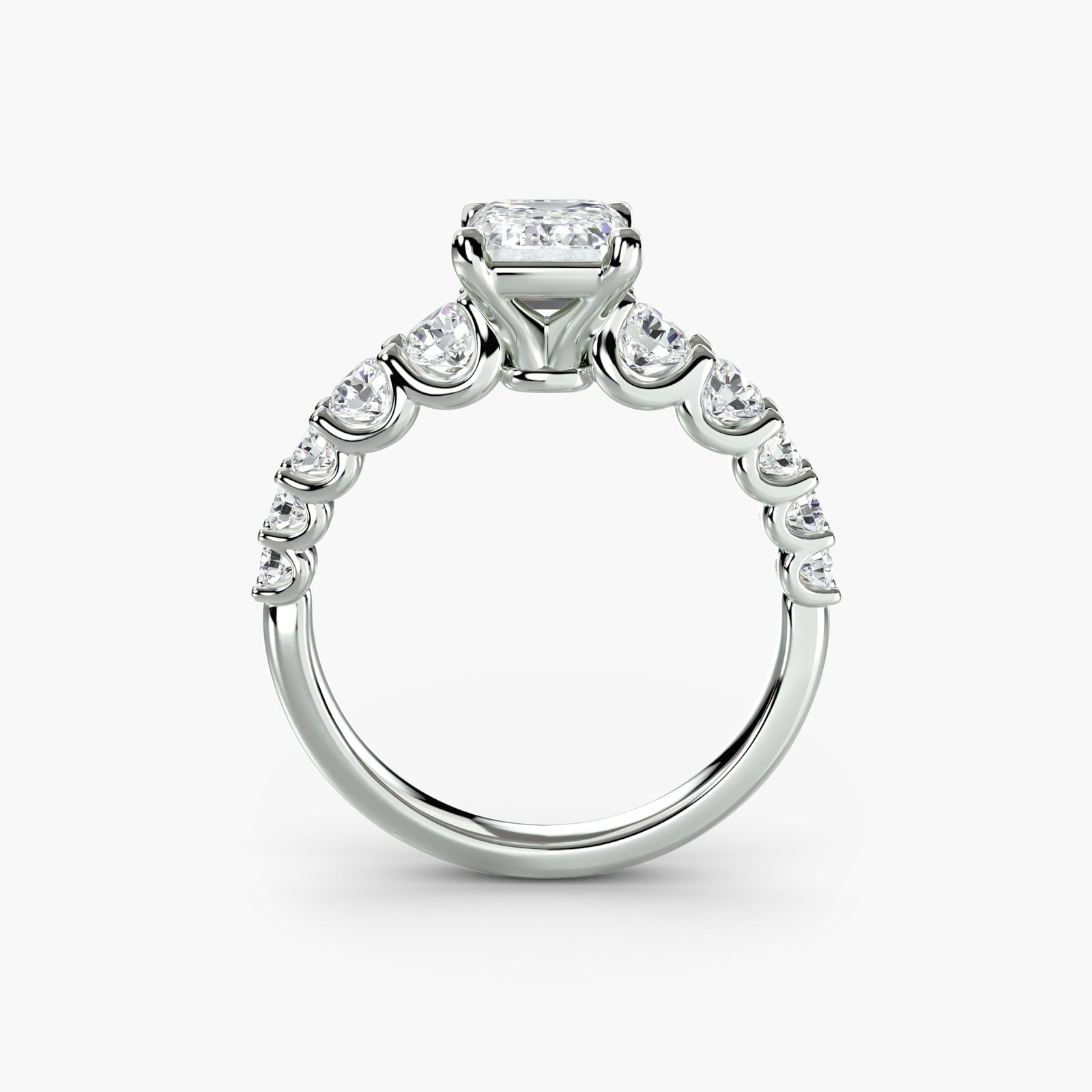 Side Stone Emerald 14Kt White Gold Ring Setting: Side Stone Emerald 14Kt White Gold Ring Setting Elevate your style with this stunning 14Kt white gold ring setting, featuring ten lab-grown emerald side stones totaling 1.38 carats in EF/VS colour and