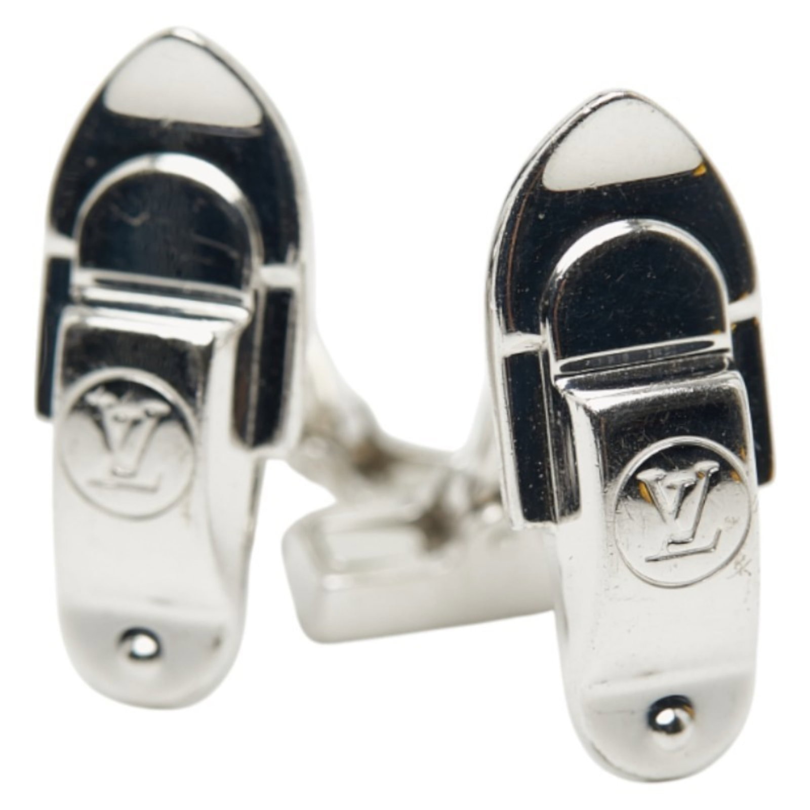 Louis Vuitton cufflinks are silver.: Louis Vuitton cufflinks are silver. These Louis Vuitton cufflinks are crafted from sterling silver (925) and feature a sleek design that adds a touch of sophistication to any outfit. With a subtle