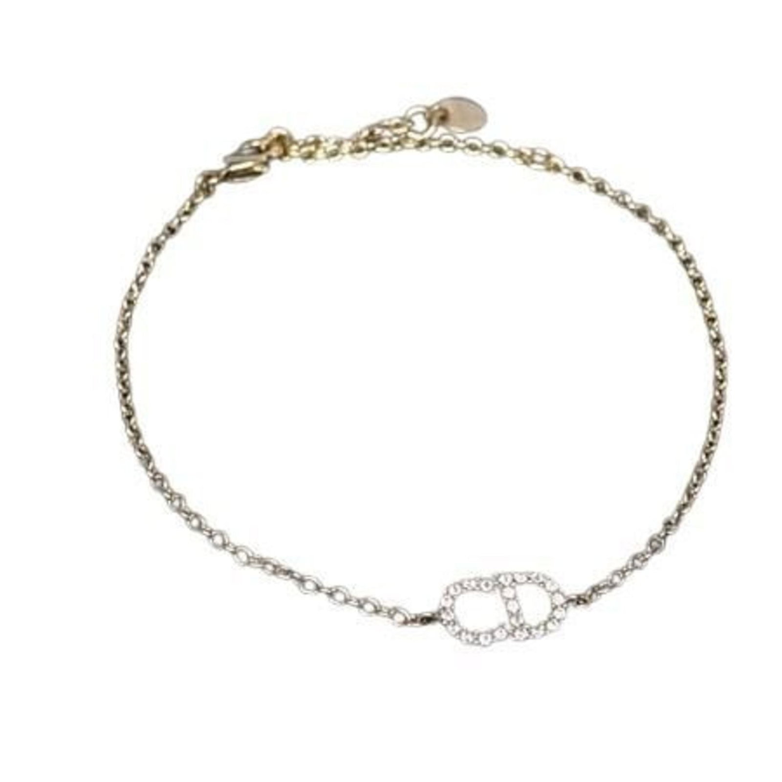 Christian Dior Charm Metal Bracelet: Christian Dior Charm Metal Bracelet A delicate touch of luxury, this 22.5cm gold charm metal bracelet from Christian Dior boasts intricate details and shines with rhinestone accents, adding a touch