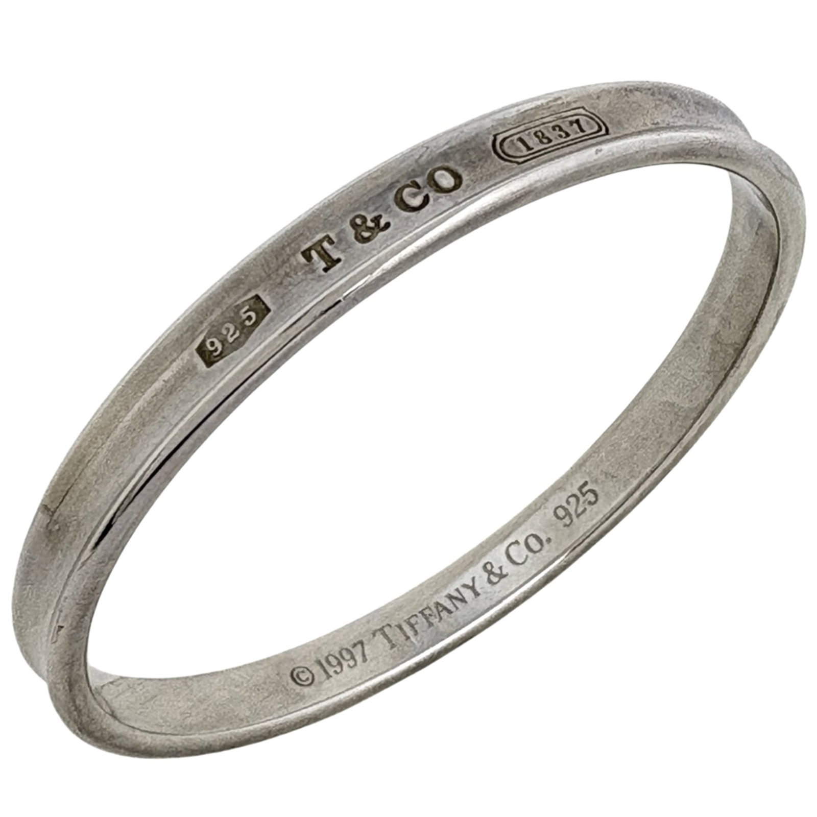 Tiffany silver bangle: Tiffany silver bangle A stunning Tiffany silver bangle adorns your wrist with its sleek 18cm length and slender 5mm width, crafted from high-quality 925 silver. With its classic design and timeless