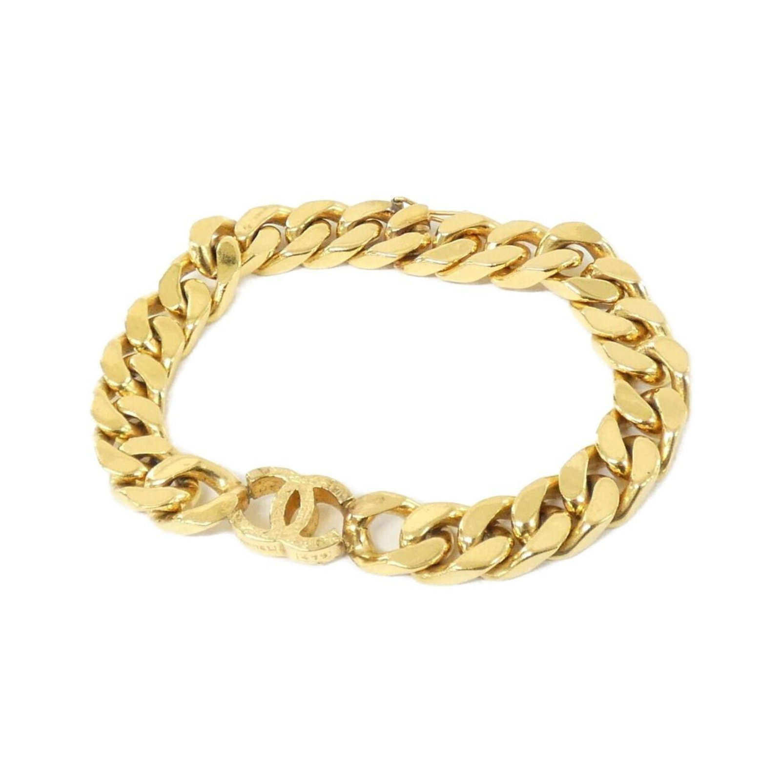 Chanel is a charm bracelet: Chanel is a charm bracelet A delicate 18cm gold charm bracelet from Chanel, featuring subtle signs of wear, with a few scratches and minor dirt marks that add to its understated elegance. The classic