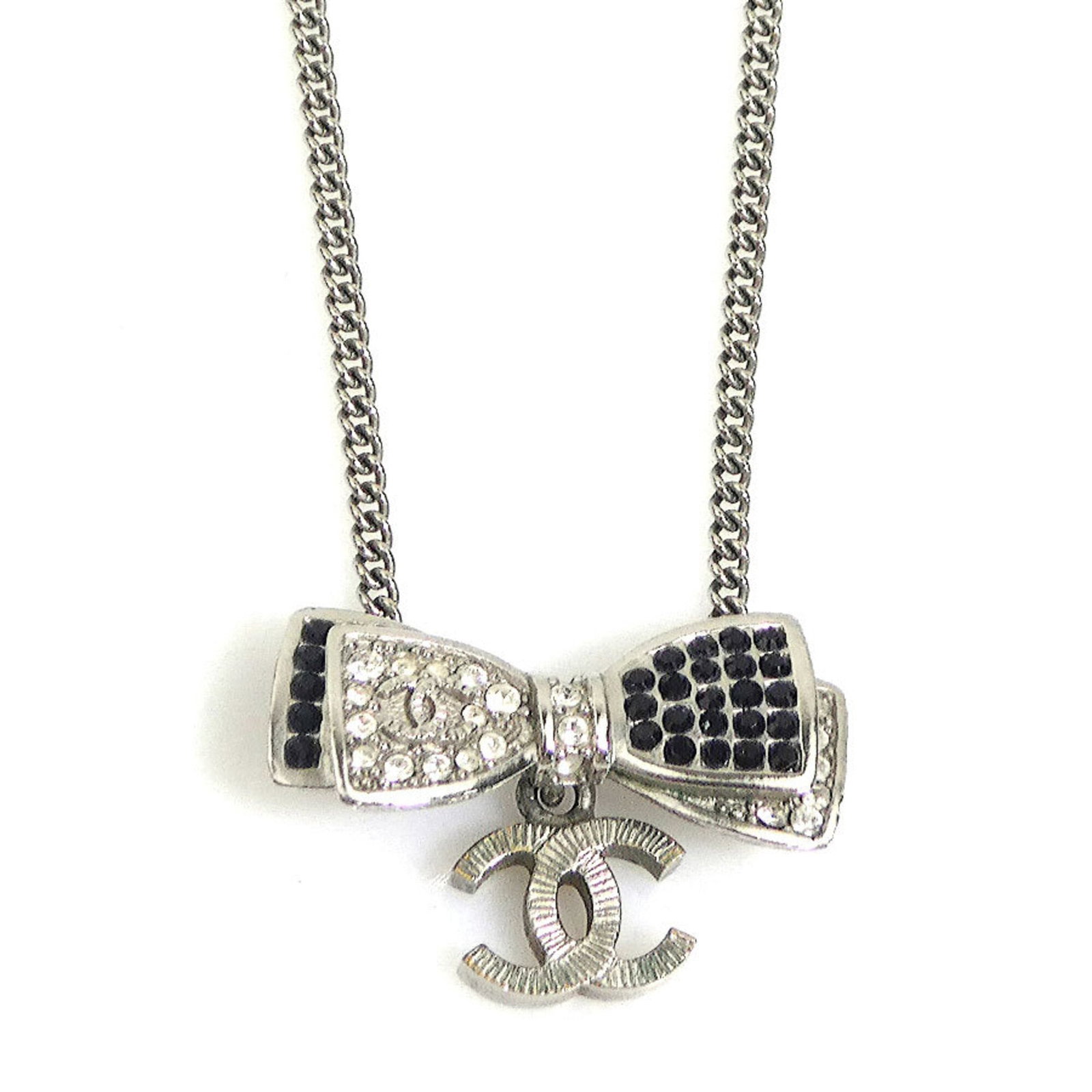 Chanel necklace, ribbon design, Coco Mark, metal, rhinestones, silver, black, women's, free: Chanel necklace, ribbon design, Coco Mark, metal, rhinestones, silver, black, women's, free Elegant and sophisticated, this Chanel necklace boasts a striking ribbon design adorned with rhinestones in