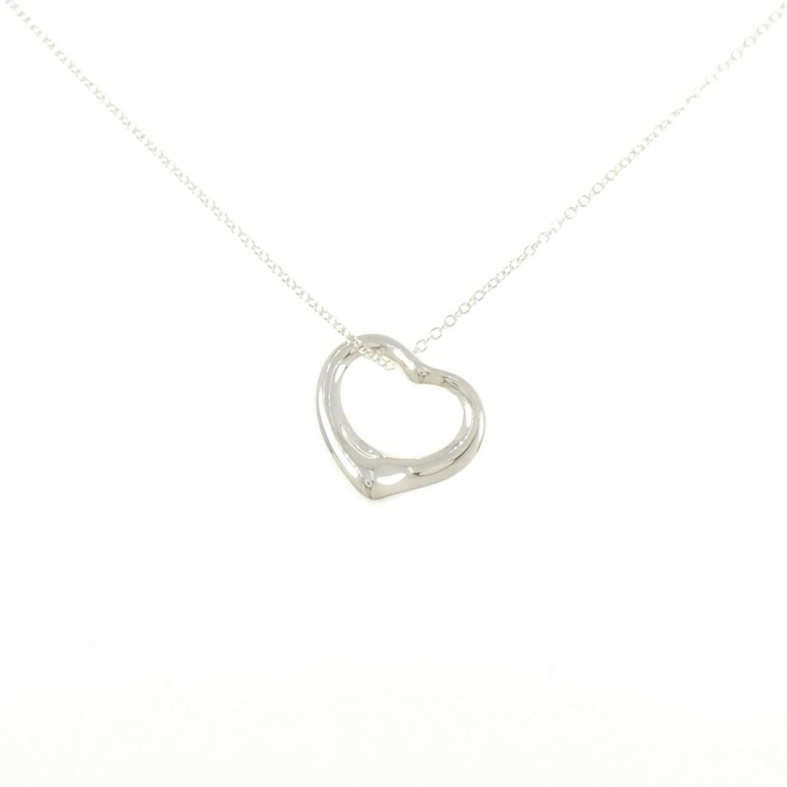 Tiffany Open Heart Necklace: Tiffany Open Heart Necklace A delicate Tiffany Open Heart Necklace, crafted from sterling silver 925, showcases a beautiful open heart pendant with intricate details. Measuring 14.5mm x 14.5mm in