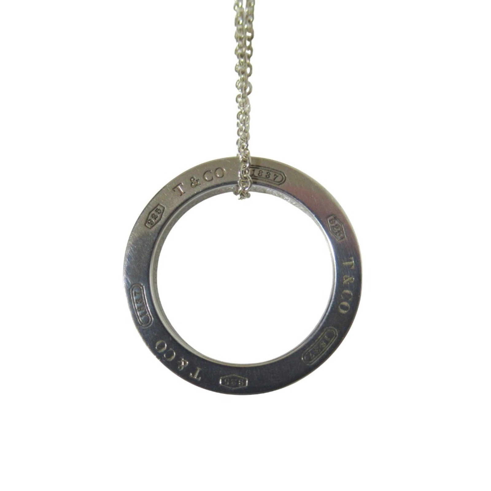 Tiffany & Co. sterling silver women's circle necklace pendant.: Tiffany & Co. sterling silver women's circle necklace pendant. A stunning sterling silver women's circle necklace pendant from Tiffany & Co., featuring a 17mm x 17mm design with a sleek, modern