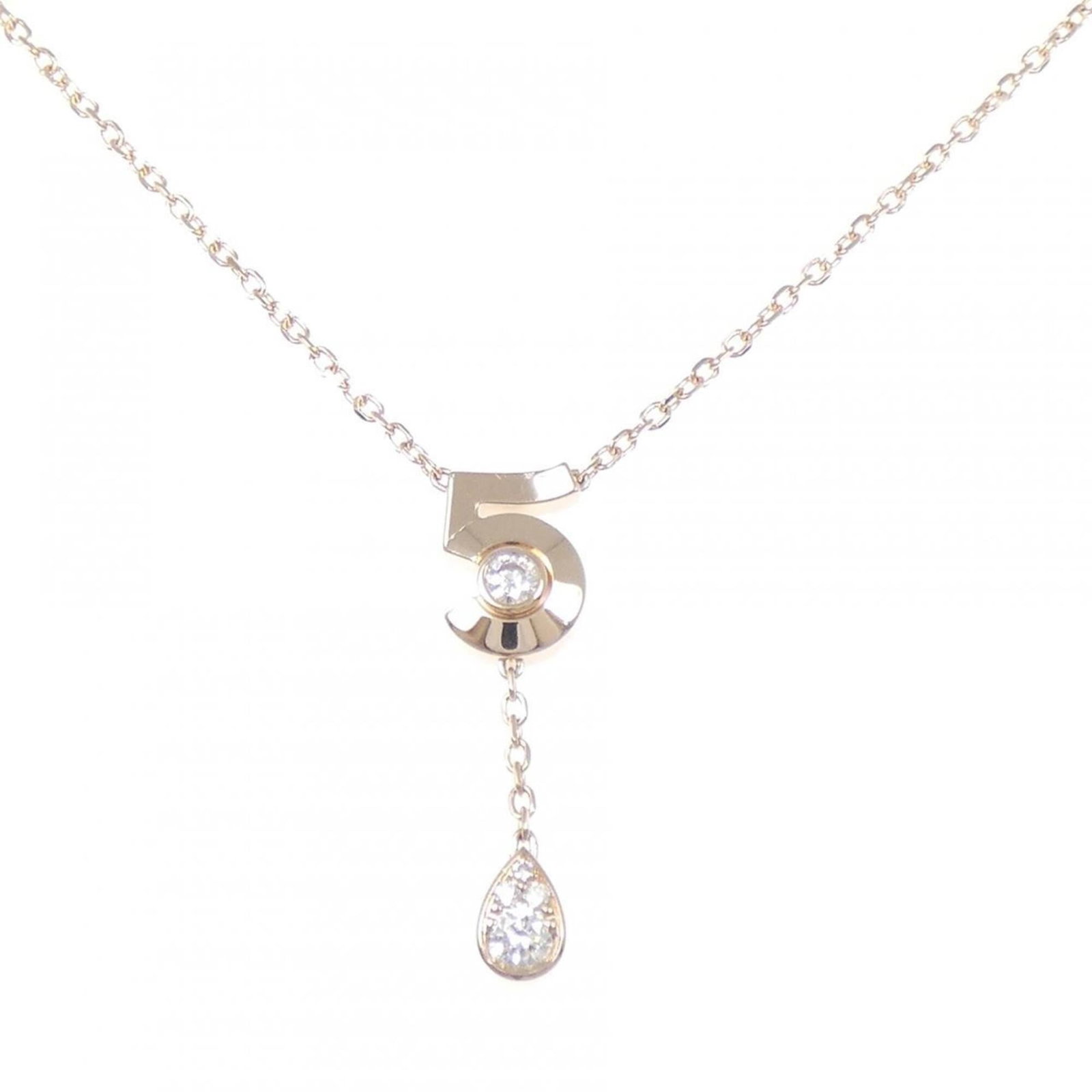 Chanel Extra de No. 5 Necklace: Chanel Extra de No. 5 Necklace Elevate your style with this exquisite Chanel Extra de No. 5 Necklace, crafted from 18K pink gold and adorned with a stunning diamond pendant. The necklace boasts a vers