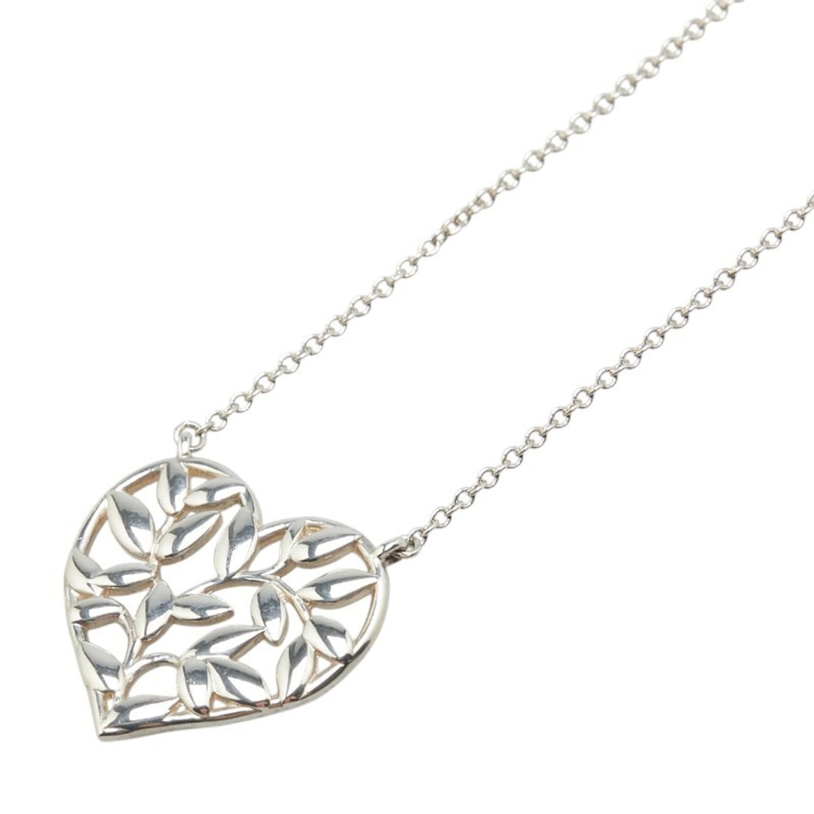 Tiffany & Co. sterling silver olive leaf heart motif necklace for women.: Tiffany & Co. sterling silver olive leaf heart motif necklace for women. A delicate sterling silver necklace from Tiffany & Co., featuring an olive leaf heart motif pendant with a 46 cm chain
