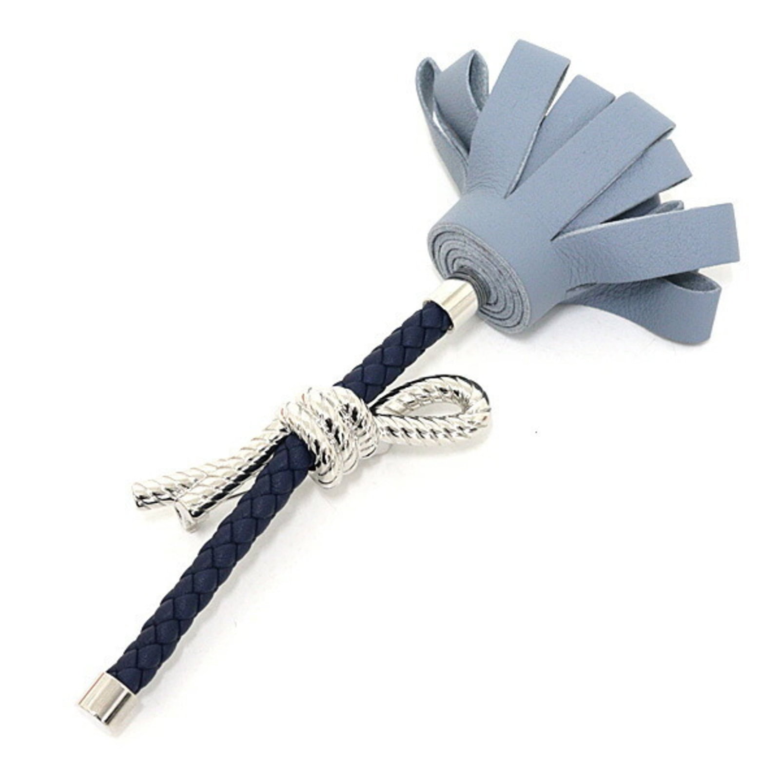 Hermes Swift Leather Brooch: Hermes Swift Leather Brooch A stunning blue and navy Swift Leather Brooch from the renowned French fashion house Hermes, crafted with high-quality leather and metal for a sleek, sophisticated look. In