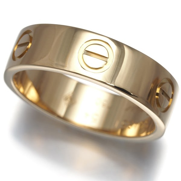 Classic yellow gold 18K Cartier ring love: Classic yellow gold 18K Cartier ring love Experience timeless elegance with this classic 18k yellow gold Cartier love ring, crafted in France to perfection. Its simplicity and sophistication make it