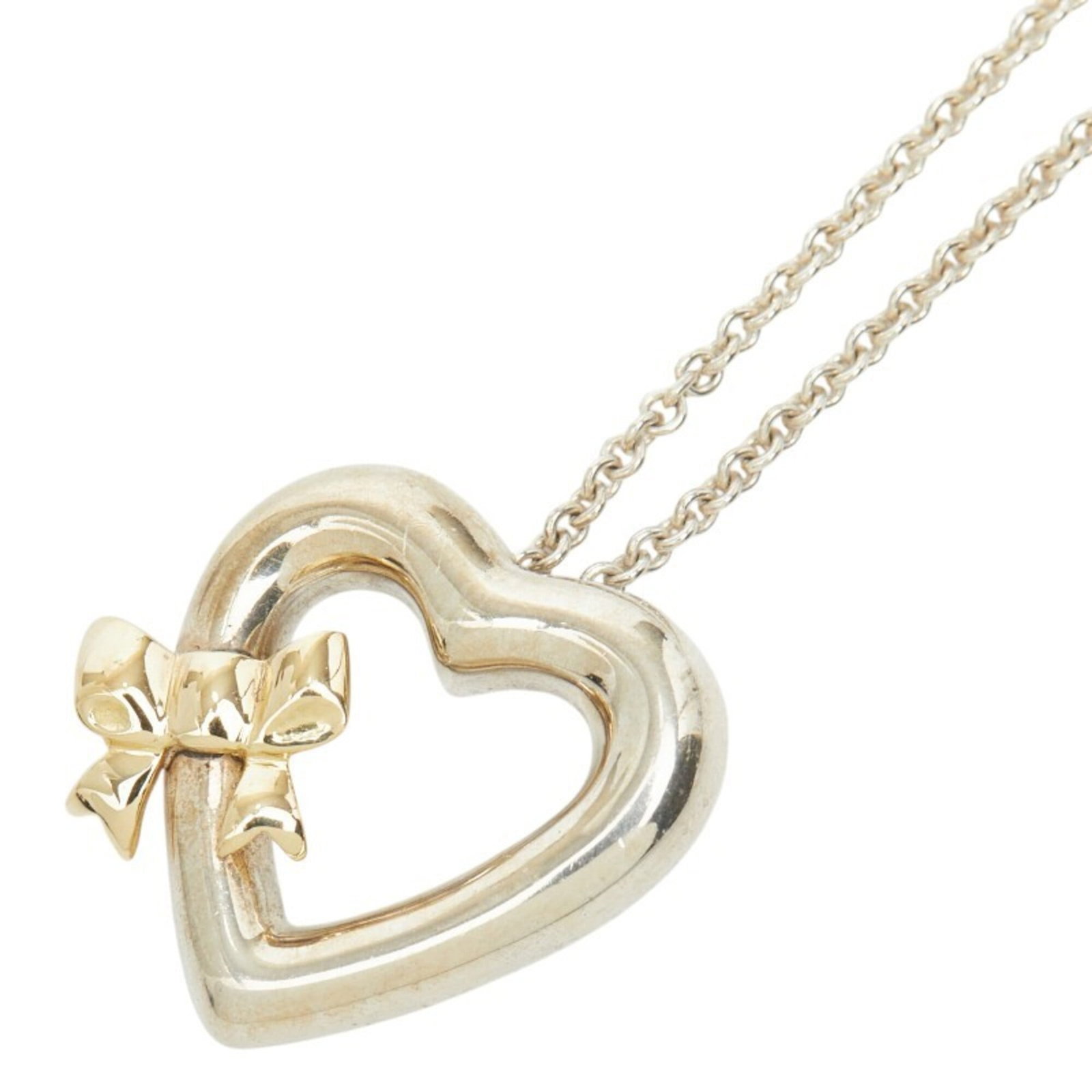 Tiffany & Co. Heart Ribbon Necklace, SV925 Sterling Silver, 18K Yellow Gold, Women's.: Tiffany & Co. Heart Ribbon Necklace, SV925 Sterling Silver, 18K Yellow Gold, Women's. Tiffany & Co.'s iconic Heart Ribbon Necklace boasts elegant design with its sterling silver and 18K yellow gold ac