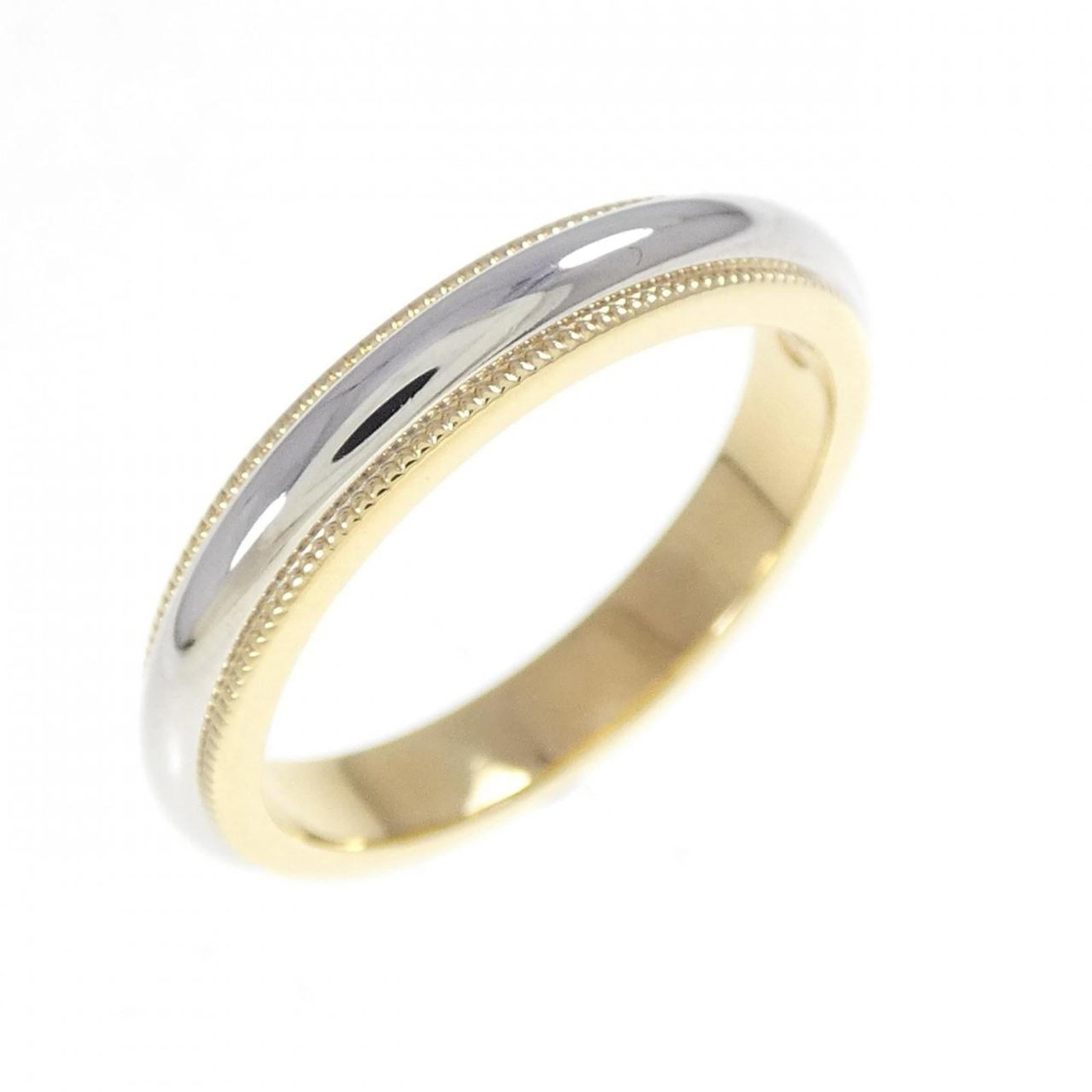 Tiffany Band Ring Platinum 950, Yellow Gold (18K): Tiffany Band Ring Platinum 950, Yellow Gold (18K) Platinum 950 and yellow gold (18K) come together in this elegant Tiffany band ring. A few traces of usage are visible, with some minor scratches and d