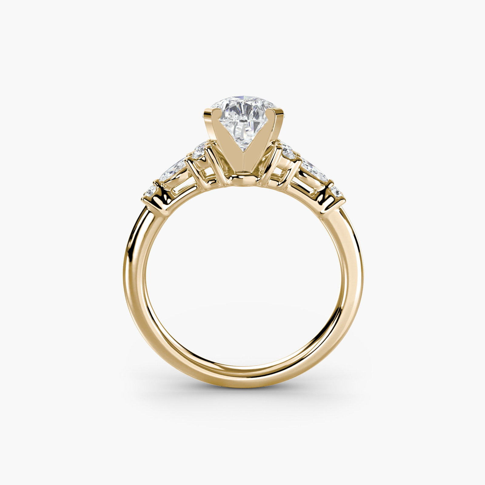Side Stone Pear 18Kt Yellow Gold Ring Setting: Side Stone Pear 18Kt Yellow Gold Ring Setting The Side Stone Pear 18Kt Yellow Gold Ring Setting boasts an elegant design with eight lab-grown side stones totaling 0.22 carats in EF/VS clarity and colo