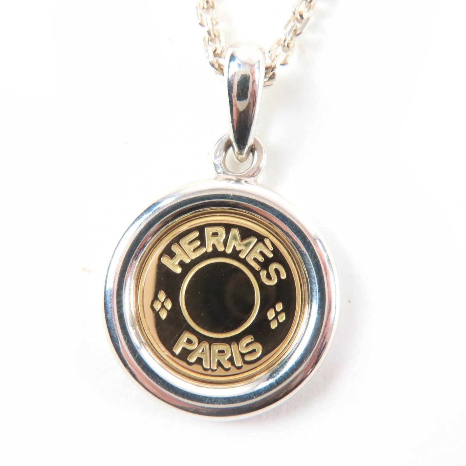 HERMES AG925 750 Sellier Hardware Combination Necklace Pendant Silver Yellow Gold Weight 11.6g: HERMES AG925 750 Sellier Hardware Combination Necklace Pendant Silver Yellow Gold Weight 11.6g Women's Silver and yellow gold combine in this elegant Hermes necklace pendant, featuring a unique combin