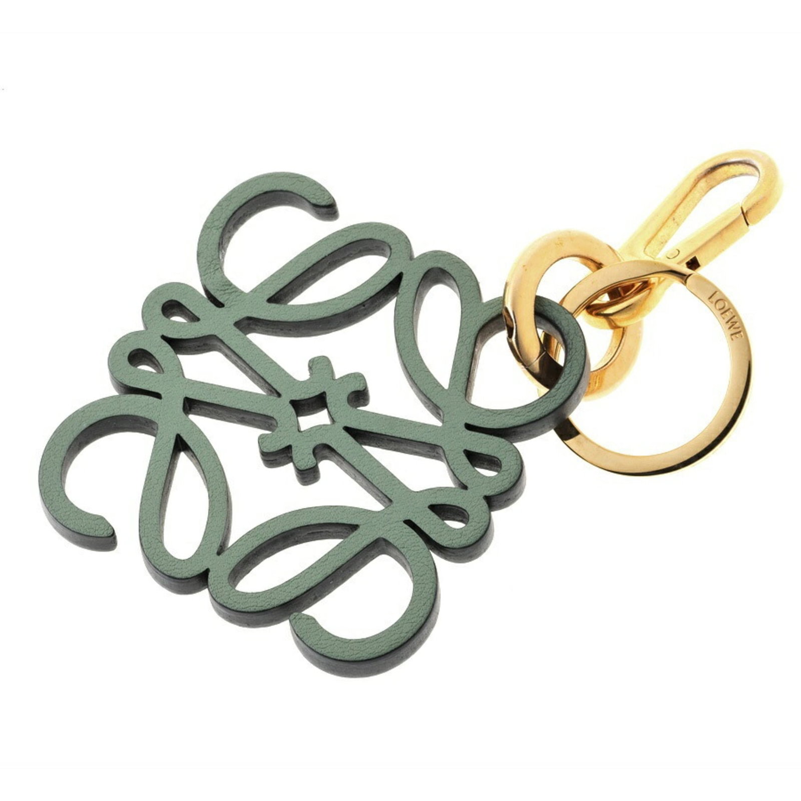 Loewe Handbag Charm Leather: Loewe Handbag Charm Leather This Loewe Handbag Charm Leather features high-quality calfskin material and a distinctive green color. With some minor scratches and dirt, this charm remains in excellent