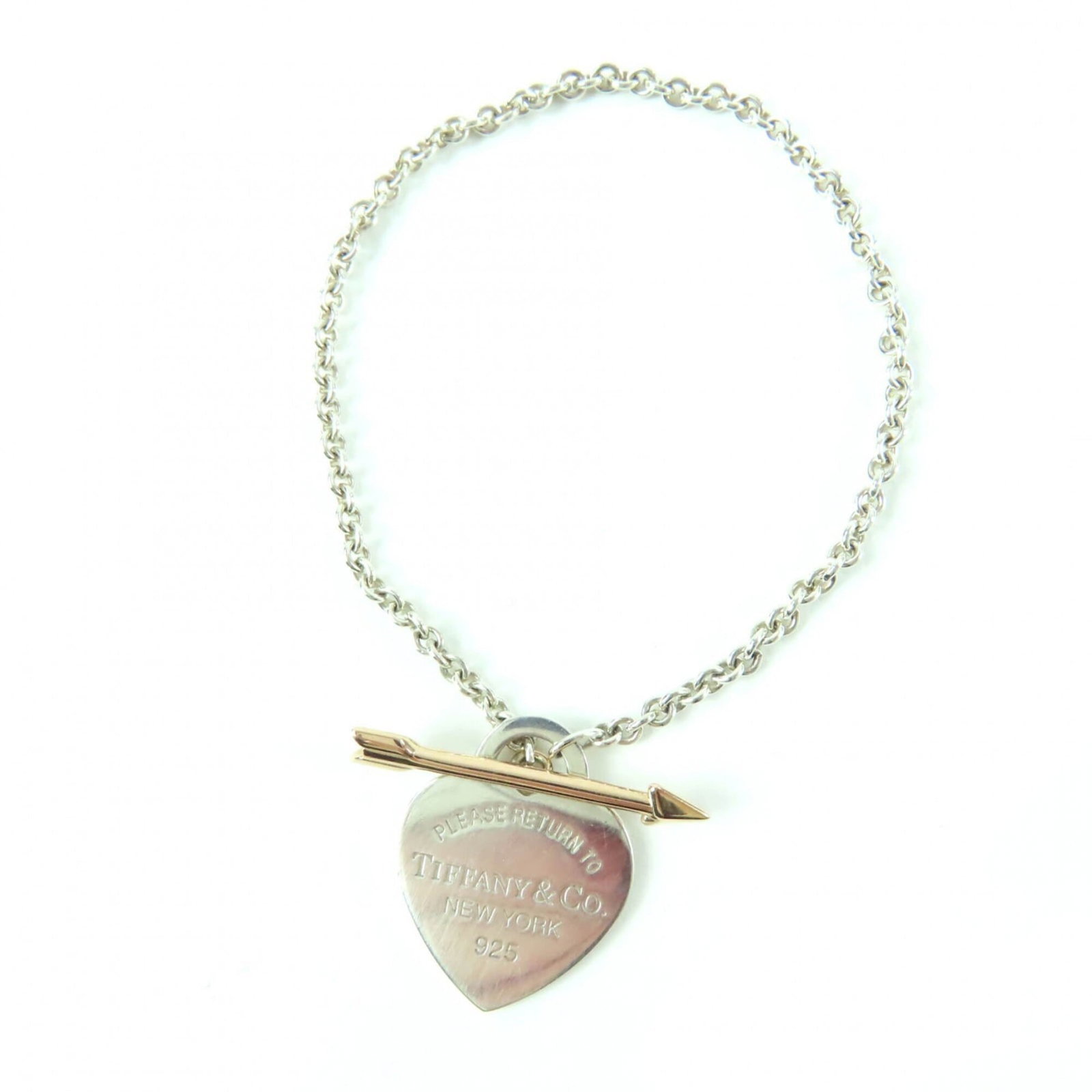 Tiffany Charm Bracelet Gold (18K), Silver 925: Tiffany Charm Bracelet Gold (18K), Silver 925 Tiffany's iconic charm bracelet shines in gold and silver, its 18K gold and sterling silver components expertly crafted to create a timeless piece. With