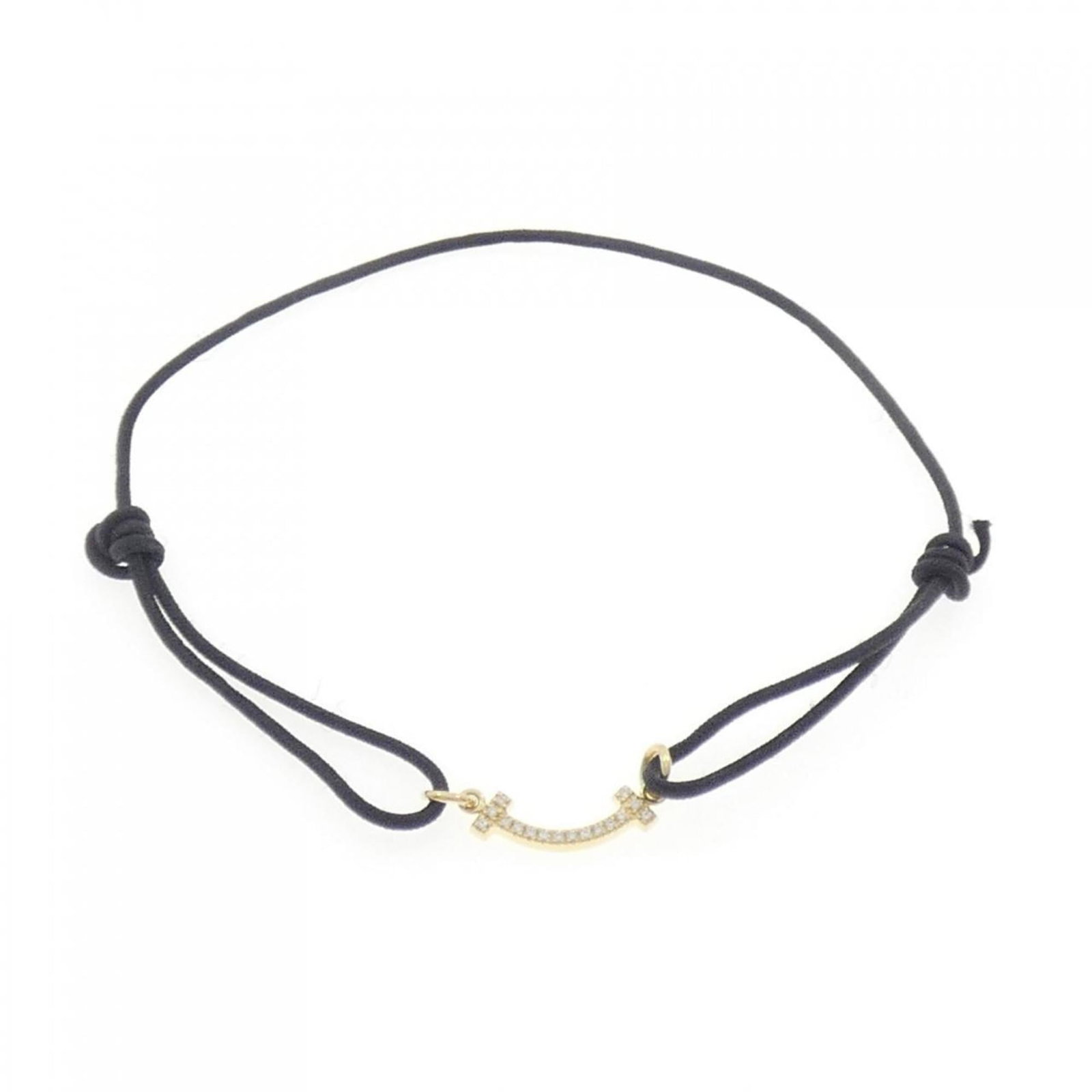 Tiffany Charm Bracelet Yellow Gold (18K): Tiffany Charm Bracelet Yellow Gold (18K) This Tiffany charm bracelet in yellow gold (18K) features a diamond stone. The piece has been used and shows traces of usage, with some damages and dirt visibl