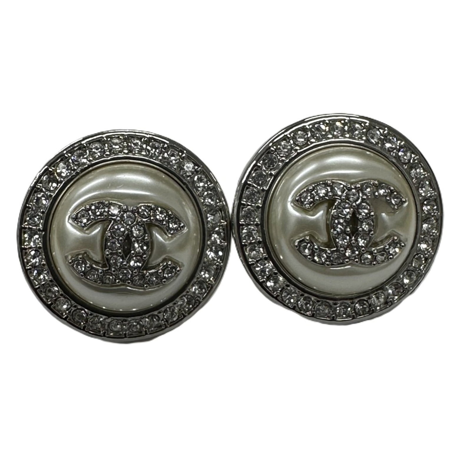 Chanel Stud Earrings: Chanel Stud Earrings Stud earrings from Chanel feature silver studs with white pearl and rhinestone accents. The items show signs of usage, including minor scratches and dirt, but remain in good condi