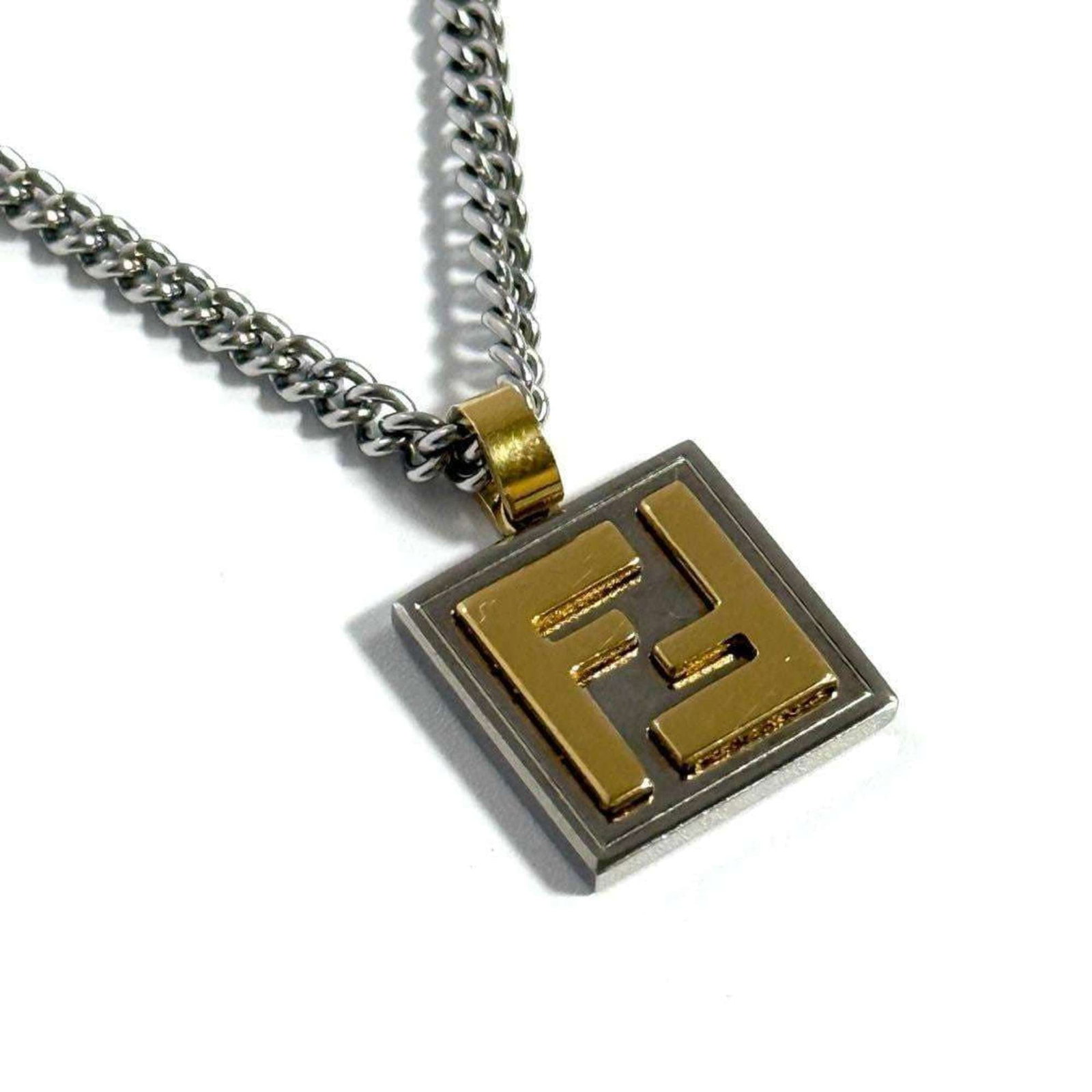 FENDI Men's Necklace Pendant Palladium & Gold Color: FENDI Men's Necklace Pendant Palladium & Gold Color Palladium and gold color Fendi men's necklace pendant offers a stylish touch to any outfit. With its metal construction and adjustable neck