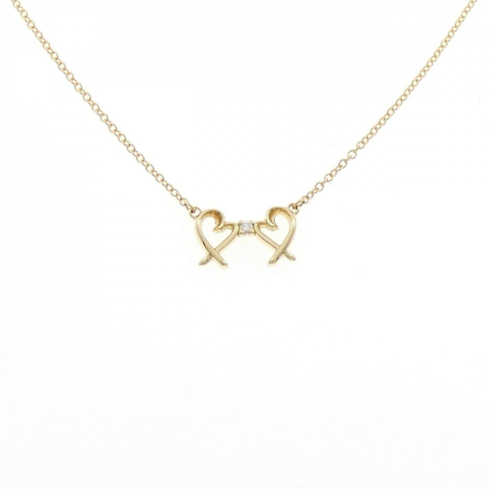 Tiffany Double Loving Heart Necklace: Tiffany Double Loving Heart Necklace Tiffany's iconic Double Loving Heart Necklace shines in yellow gold (18K), its elegant design featuring a pendant with a subtle 6.6mm x 11.6mm size. This pre-owned
